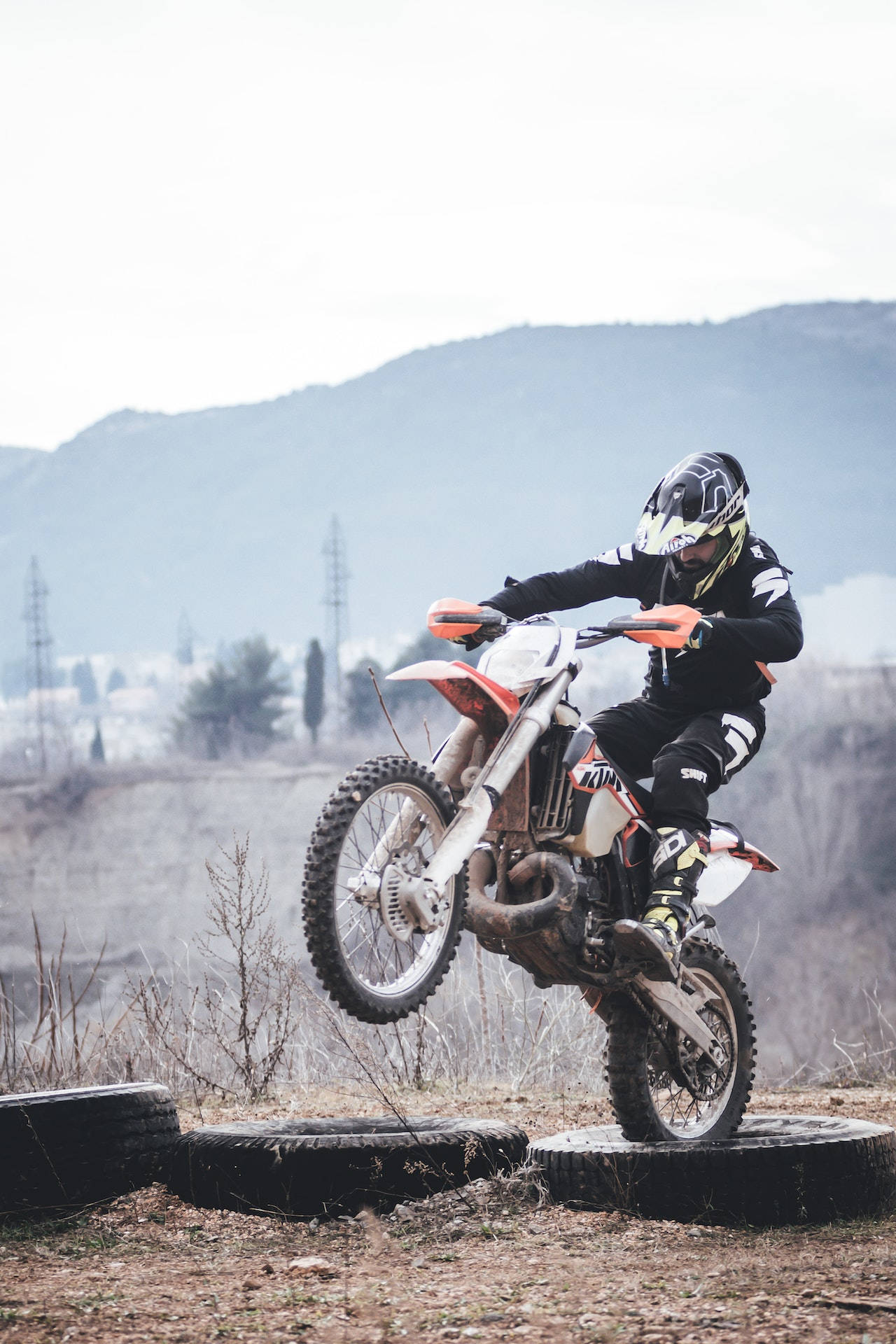 motocross rider, full gear, stacked tires, Full HD Phone Wallpaper
