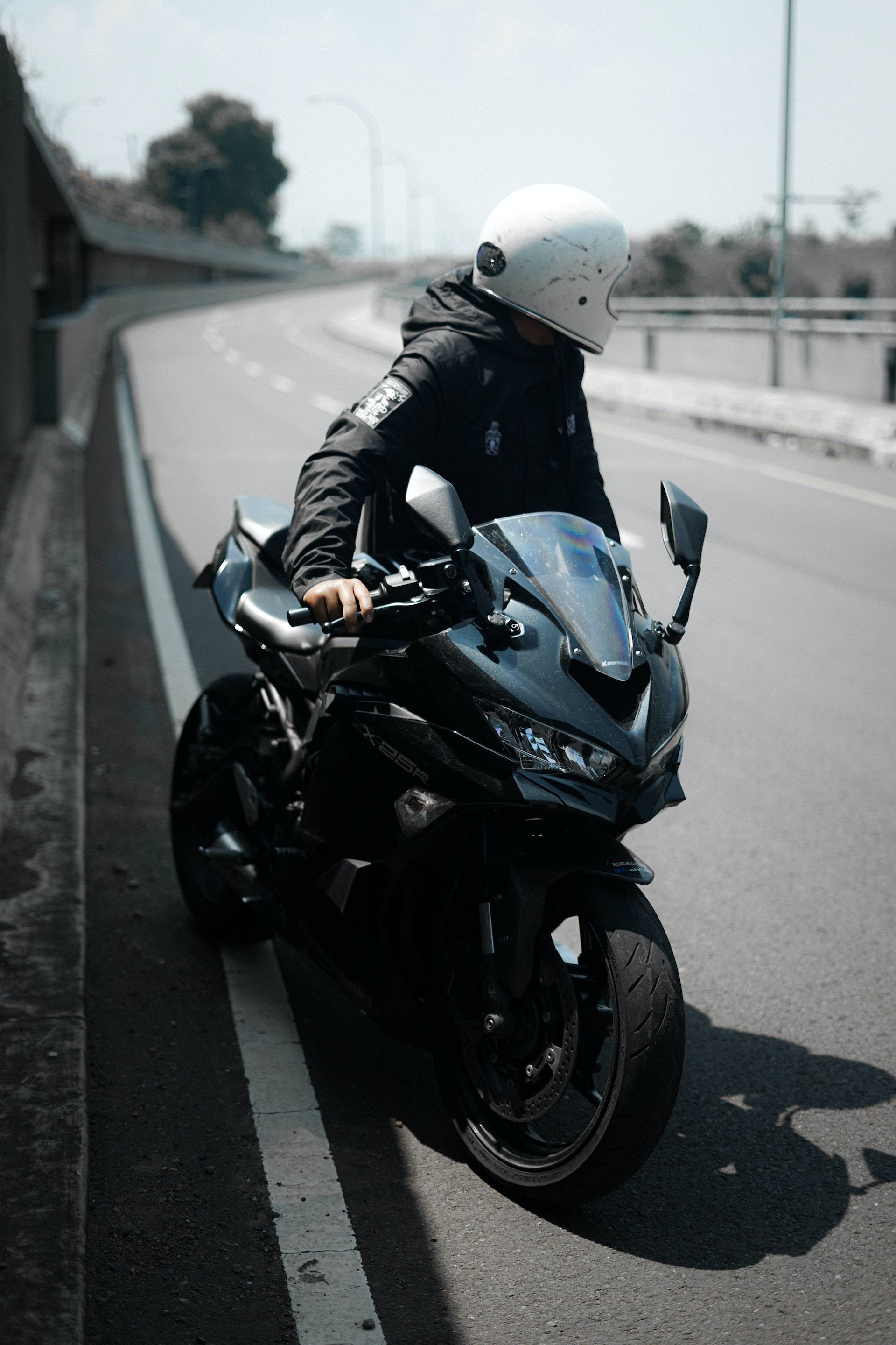 black motorcycle, white helmet, sunlit highway, 2K Phone Wallpaper