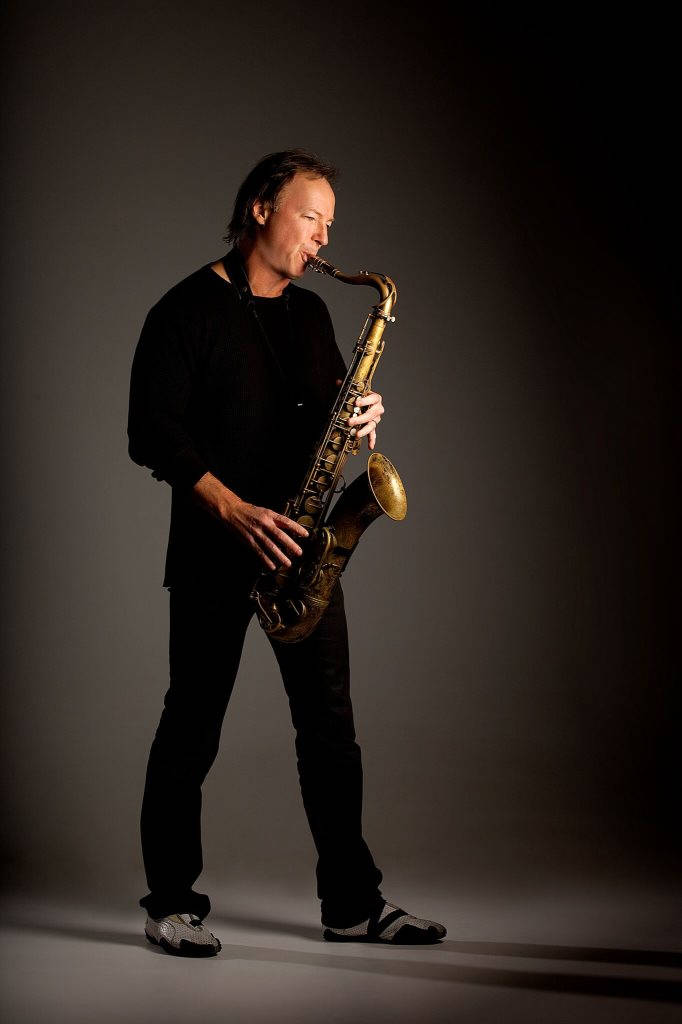 Bill Evans, golden saxophone, black attire, SD Phone Wallpaper