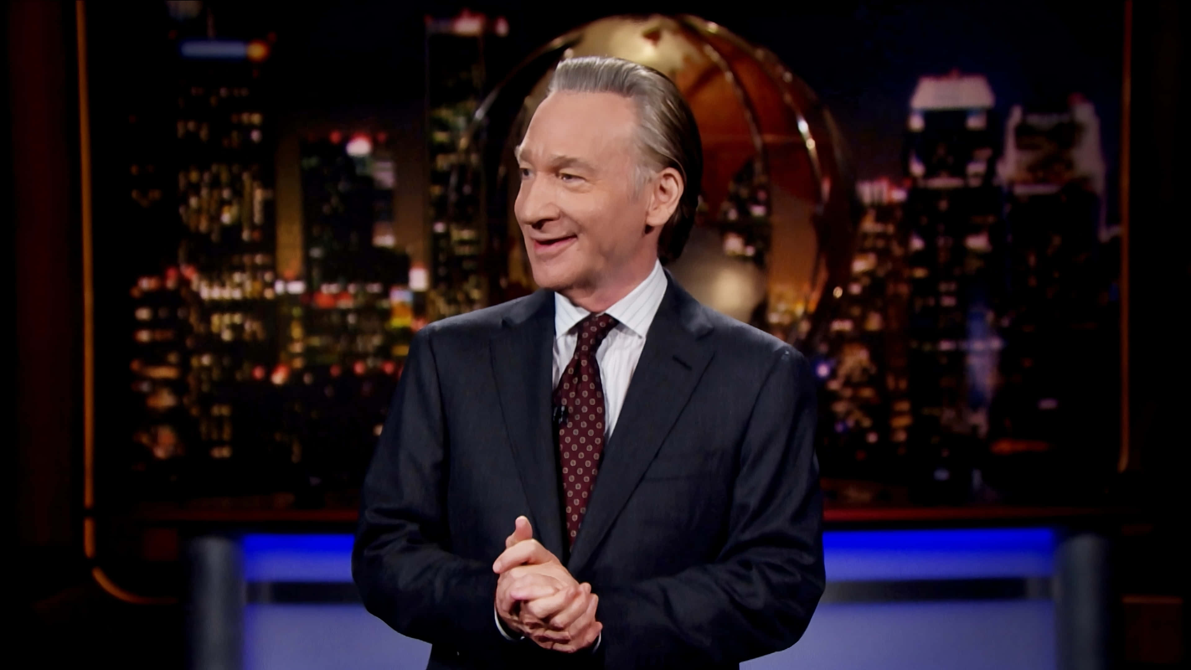 Bill Maher, suit, glowing cityscape, 4K Desktop Wallpaper