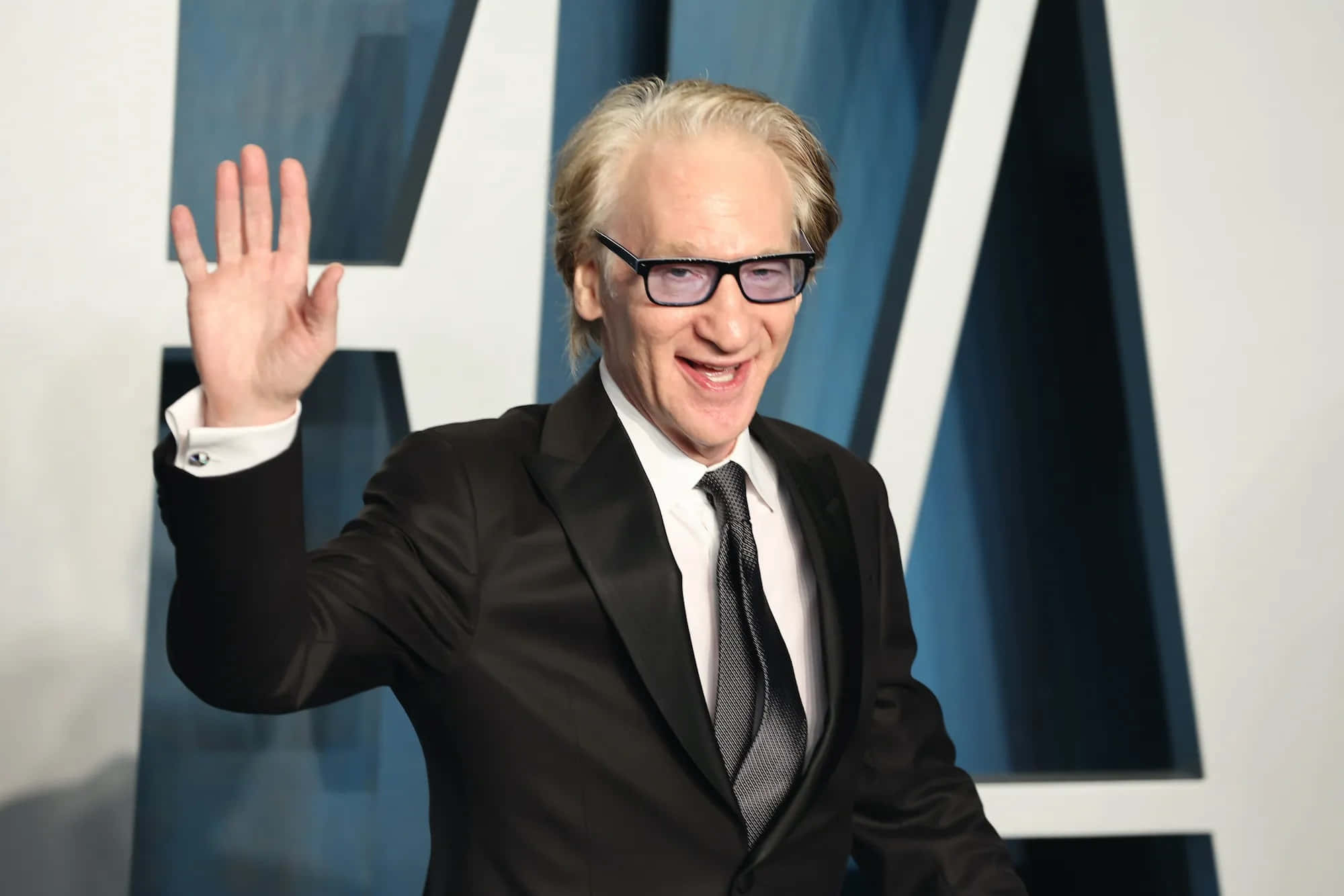 Bill Maher, black suit, blue and white geometric backdrop, Full HD Desktop Wallpaper