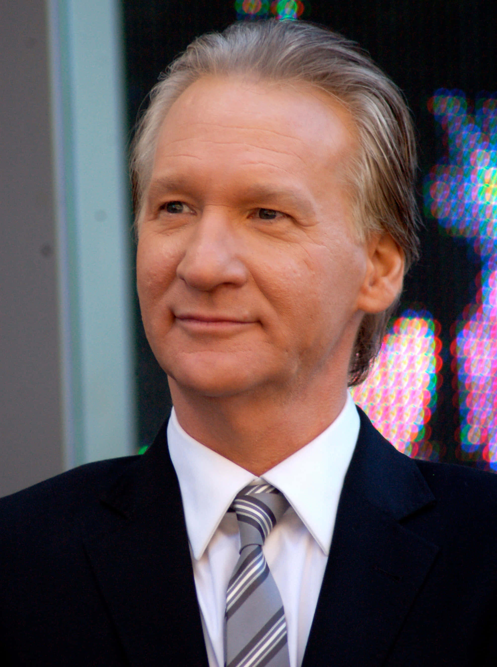 Bill Maher, graying hair, dark suit, 2K Phone Wallpaper
