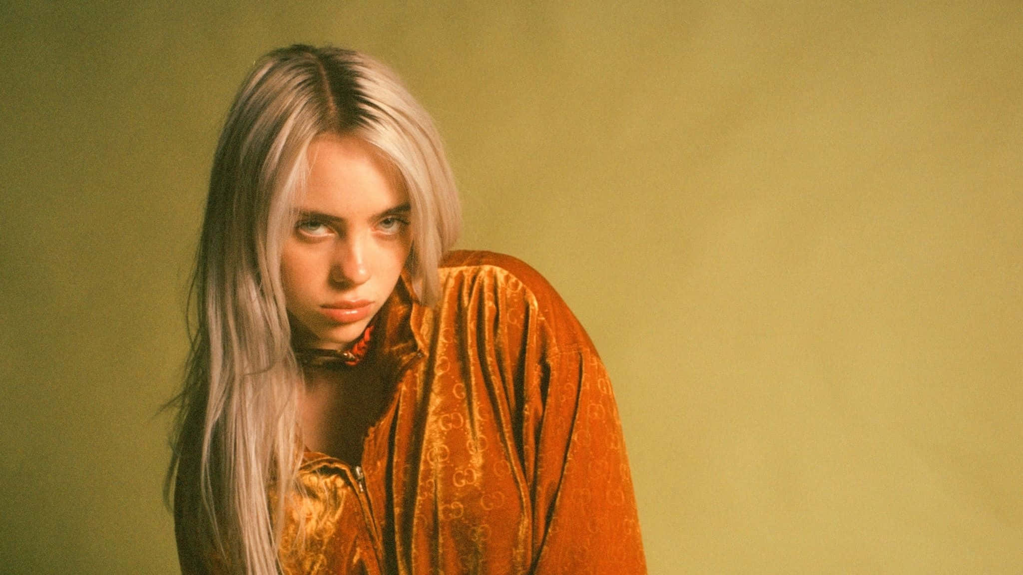 Billie Eilish, platinum blonde hair, rich orange velvet outfit, Full HD Desktop Wallpaper