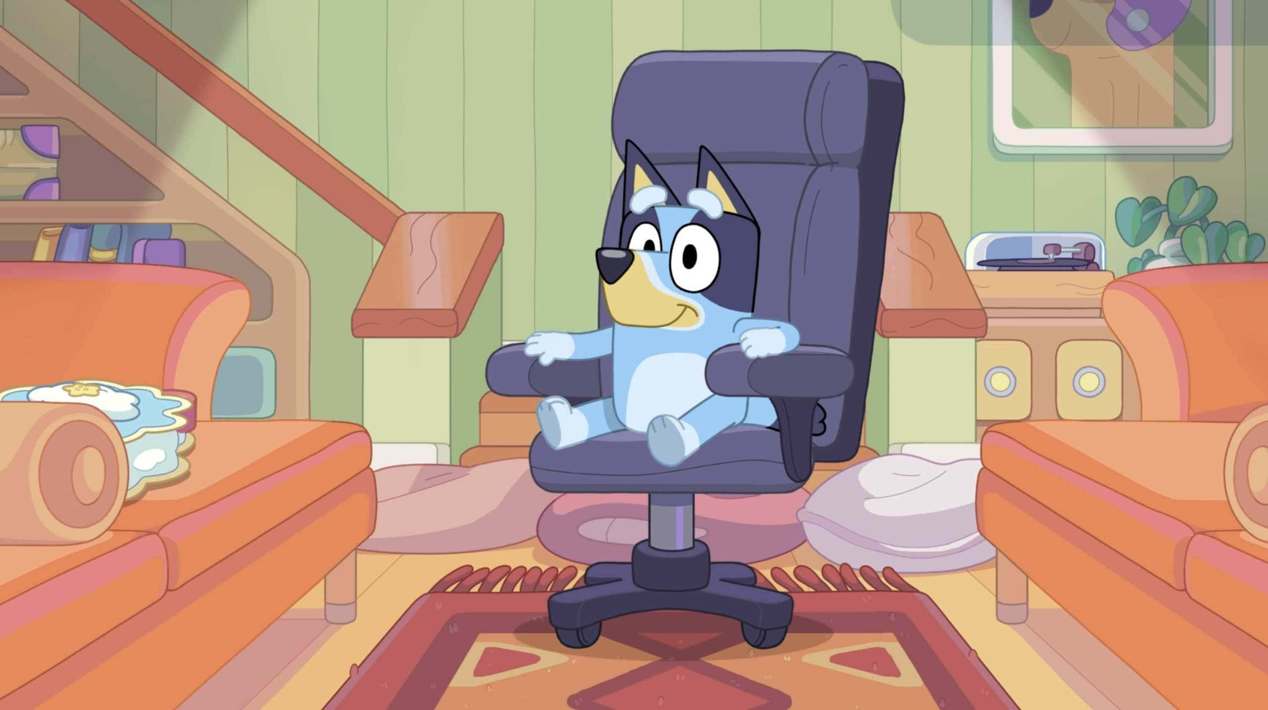 Bluey, blue-heeler puppy, black office chair, 2K Desktop Wallpaper