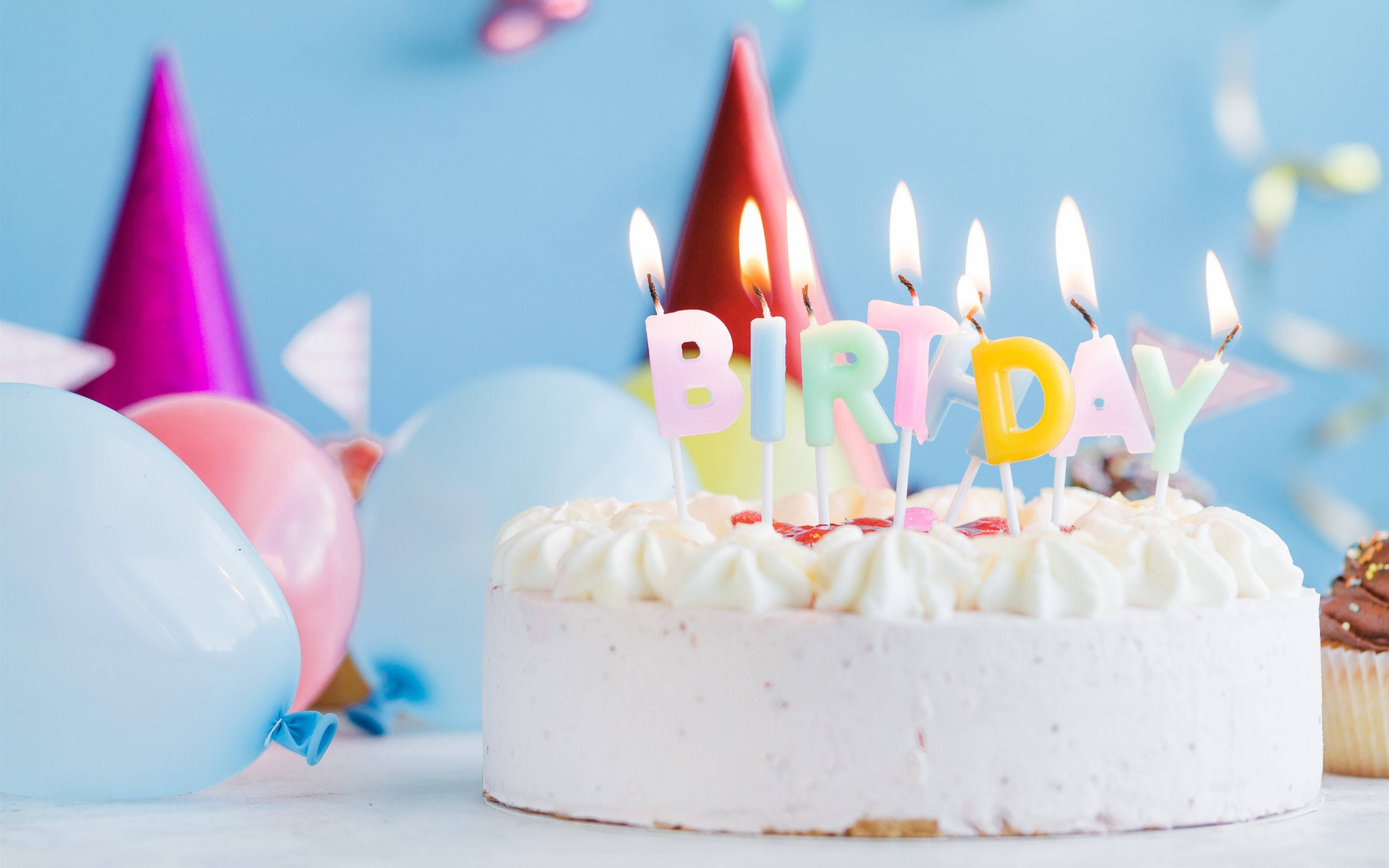 pastel white birthday cake, lit candles, colorful letter candles, 2K Desktop Wallpaper