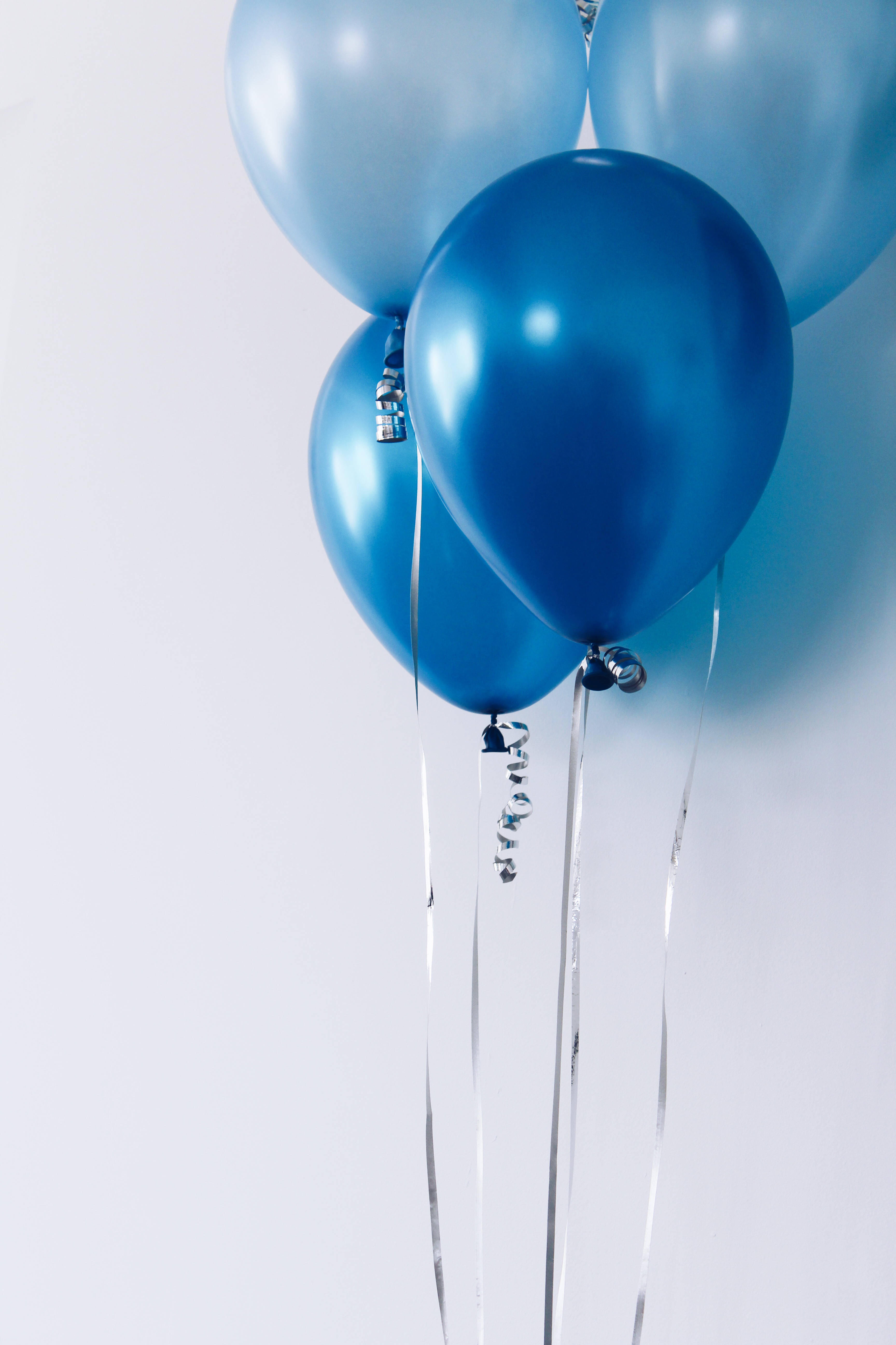 light dark blue metallic balloons, silver ribbons, soft white background, 5K Phone Wallpaper
