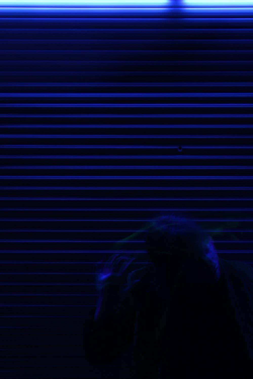 blue-lit metal shutter, glowing neon sign, shadowy figure, HD Phone Wallpaper