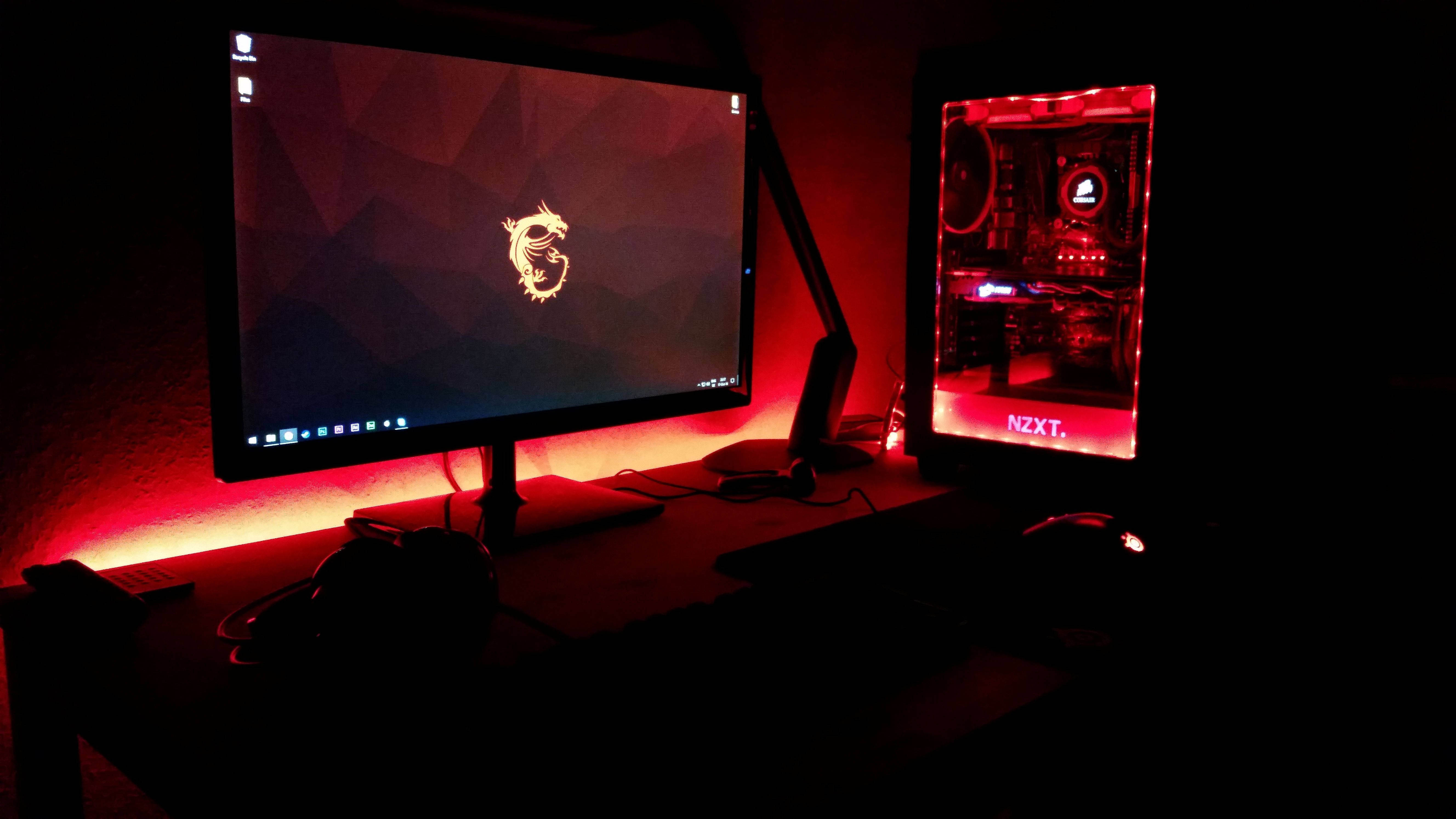 red LED lighting, monitor displaying a dragon logo, transparent NZXT PC case, 5K Desktop Wallpaper