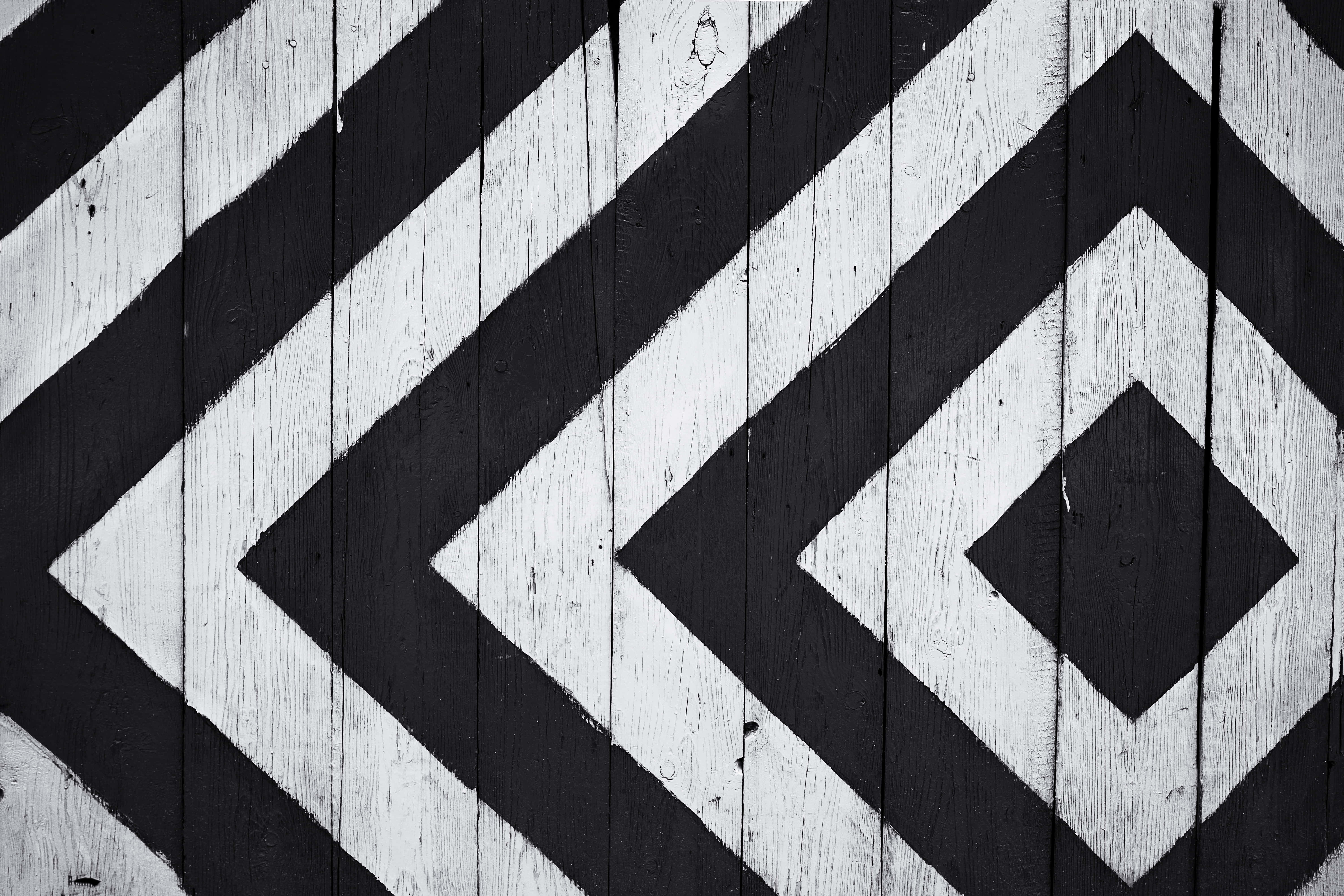 black and white geometric diamond patterns, weathered wooden planks, high-contrast abstract design, 5K Desktop Wallpaper