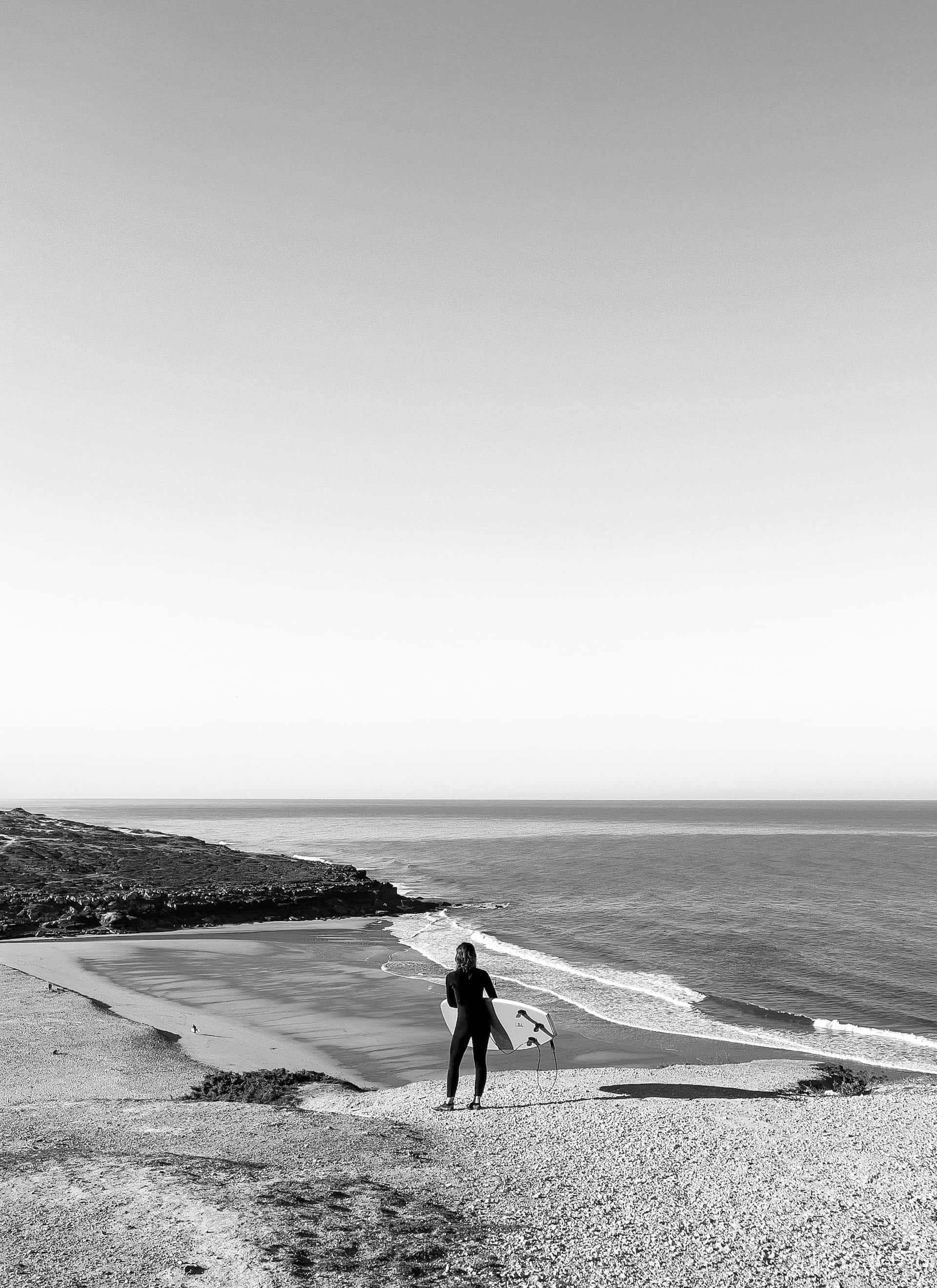 Black And White Beach, pebbled shore, wetsuit, 2K Phone Wallpaper