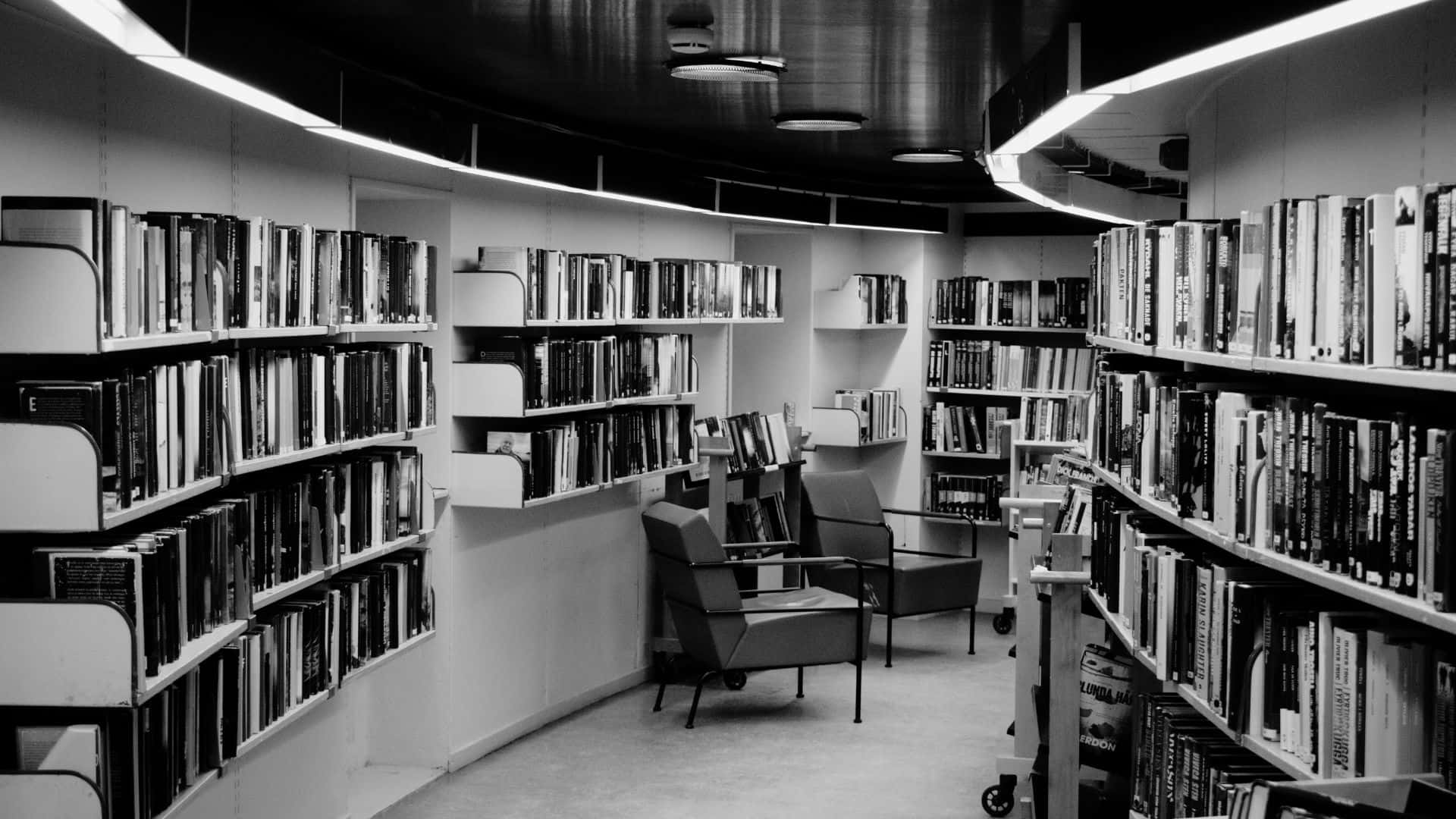 black and white book, wooden table, curved library aisle, Full HD Desktop Wallpaper