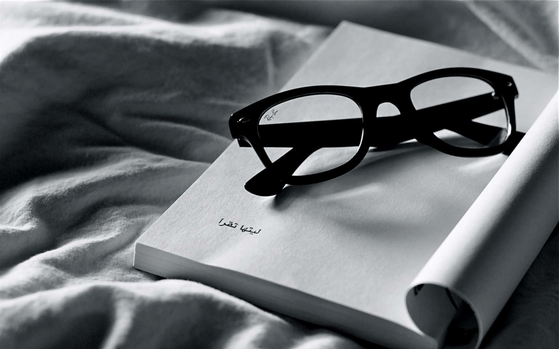 black-rimmed glasses, open book, Arabic text, Full HD Desktop Wallpaper