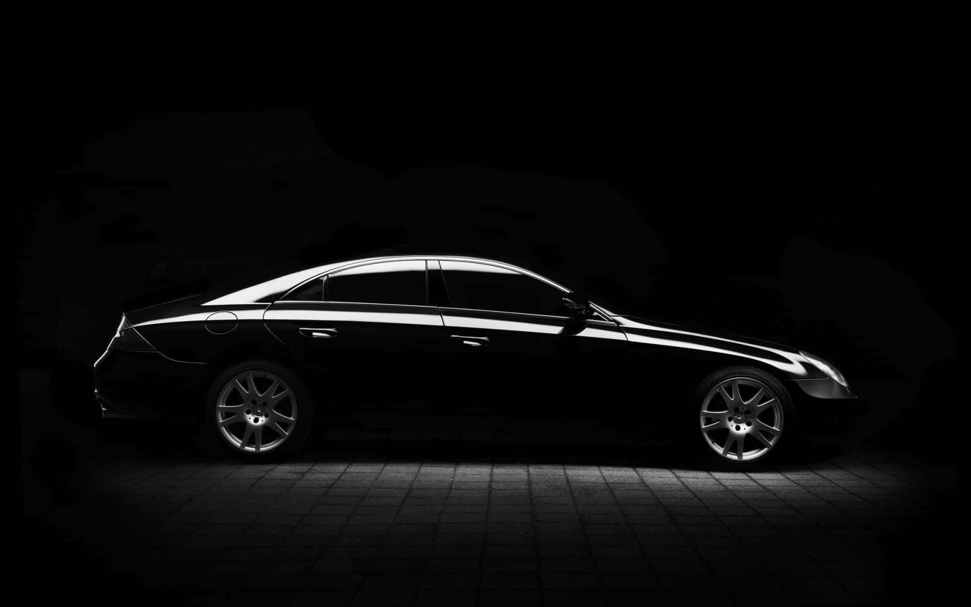 black luxury sedan, white highlights, dark studio backdrop, Full HD Desktop Wallpaper