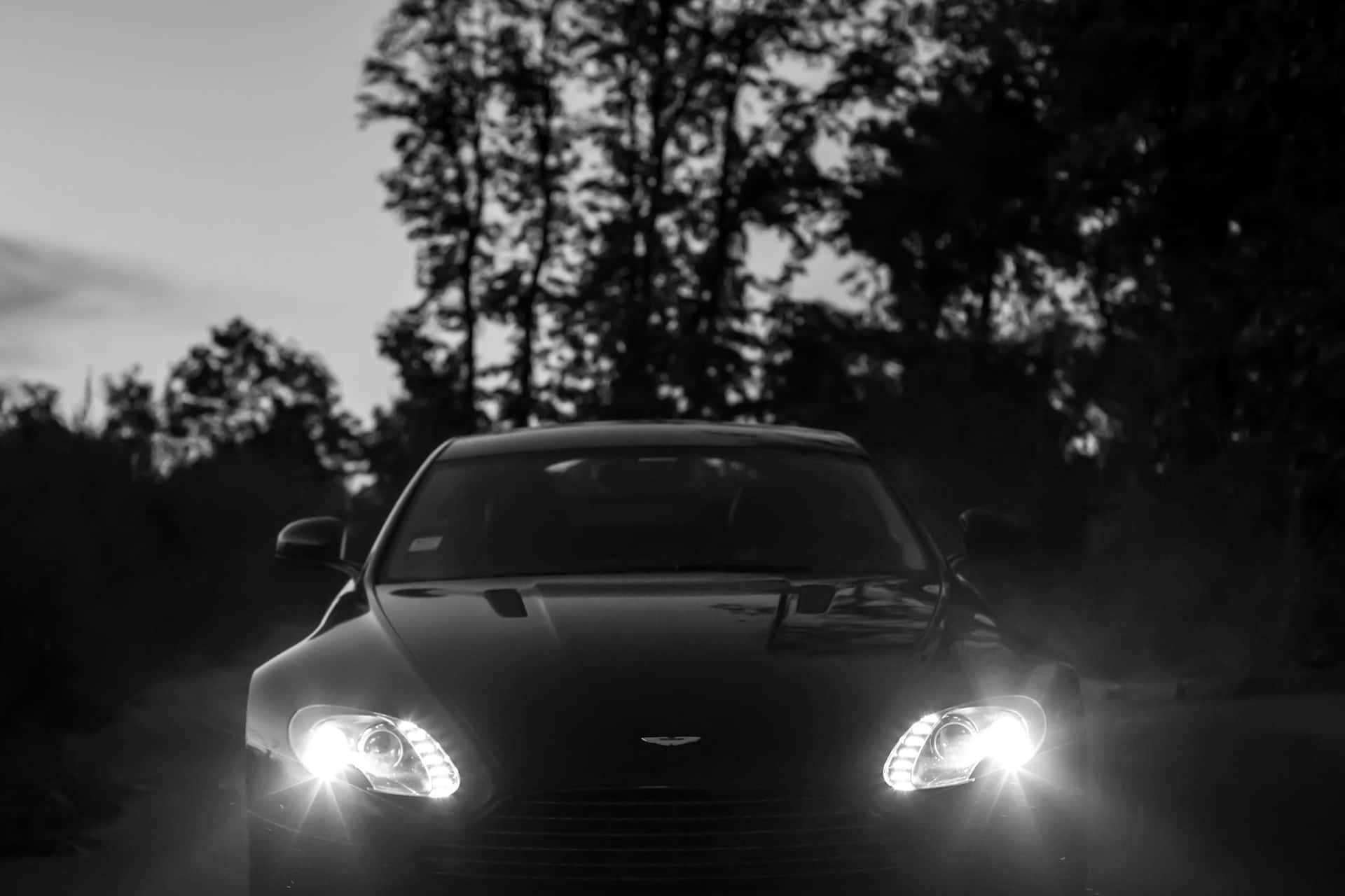 sleek sports car, glowing headlights, misty forest, Full HD Desktop Wallpaper