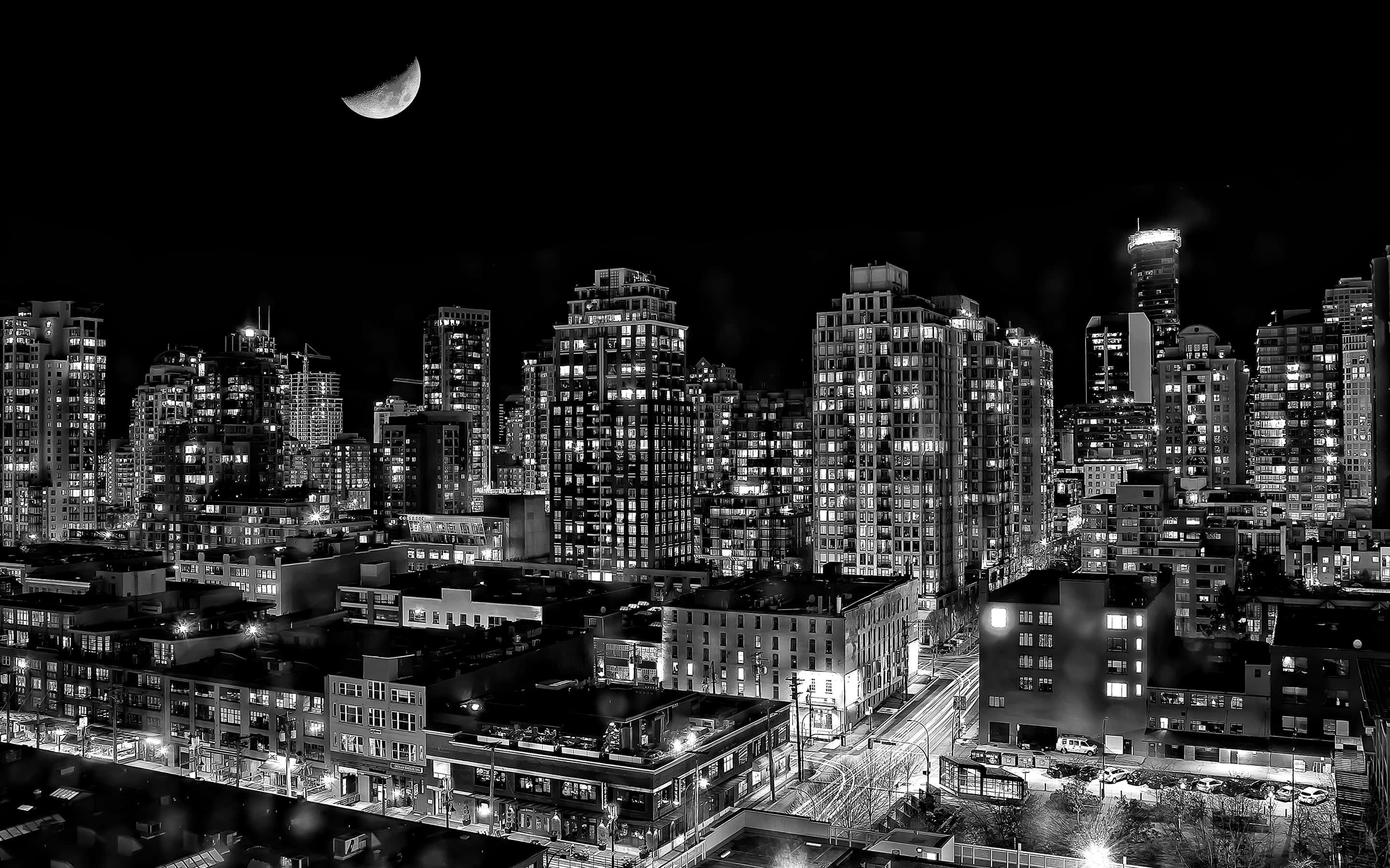 Monochrome City Nightscape, crescent moon, glowing skyscrapers, 2K Desktop Wallpaper