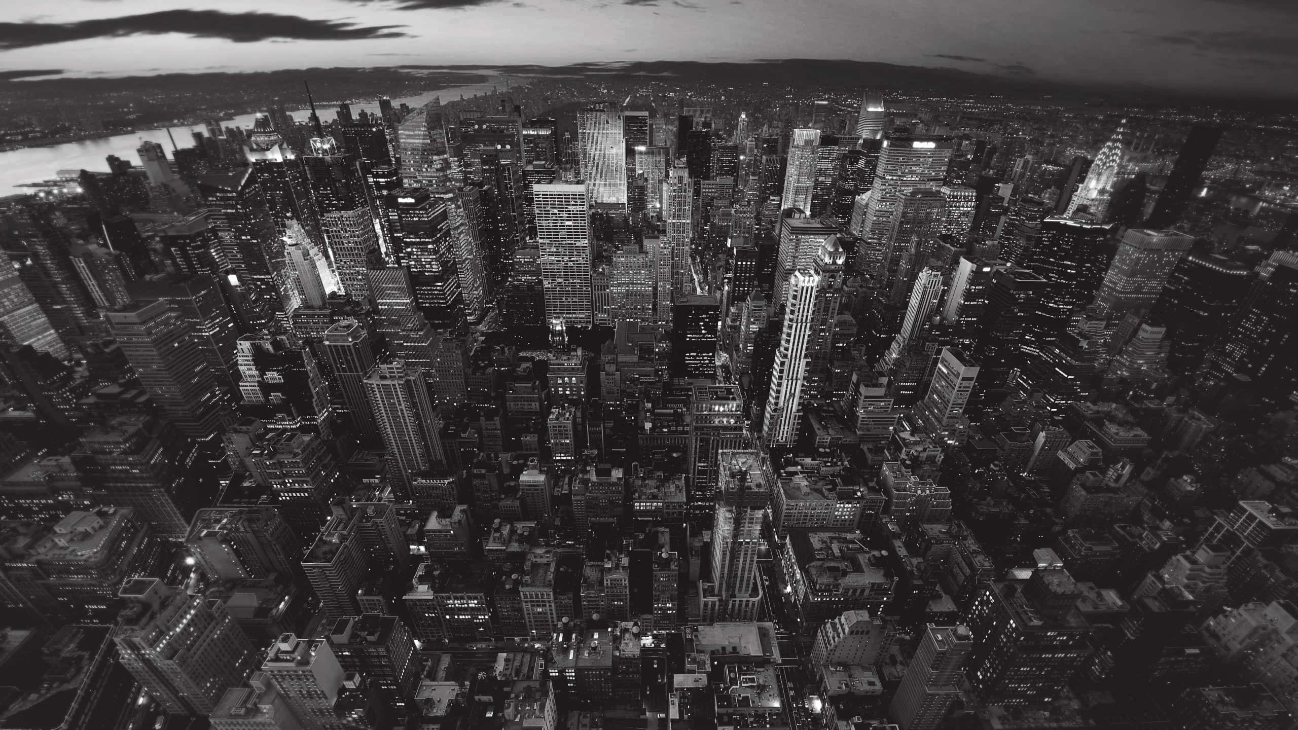 black and white cityscape, twilight, illuminated skyscrapers, 2K Desktop Wallpaper