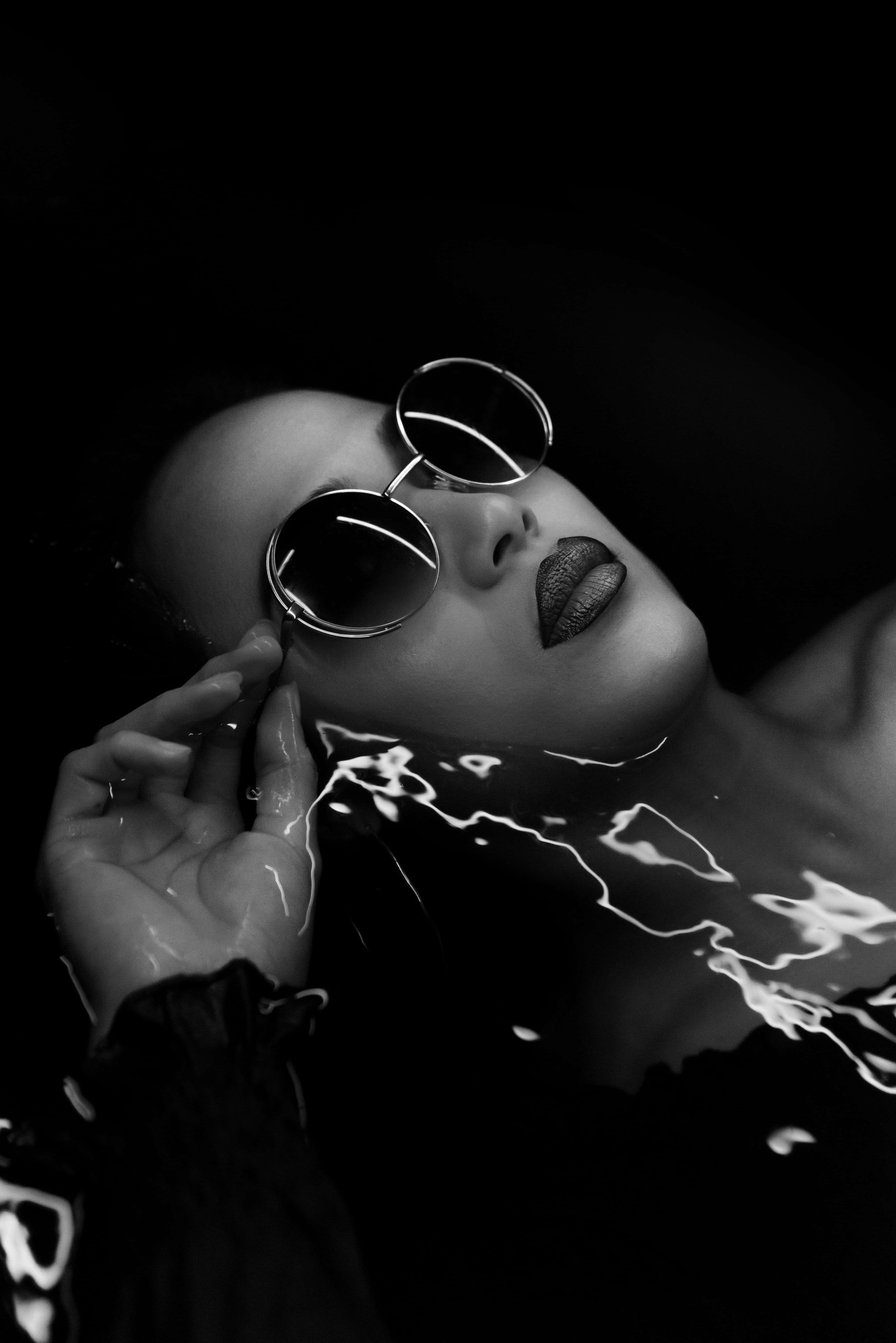 monochrome portrait, dark water, round sunglasses, 5K Phone Wallpaper