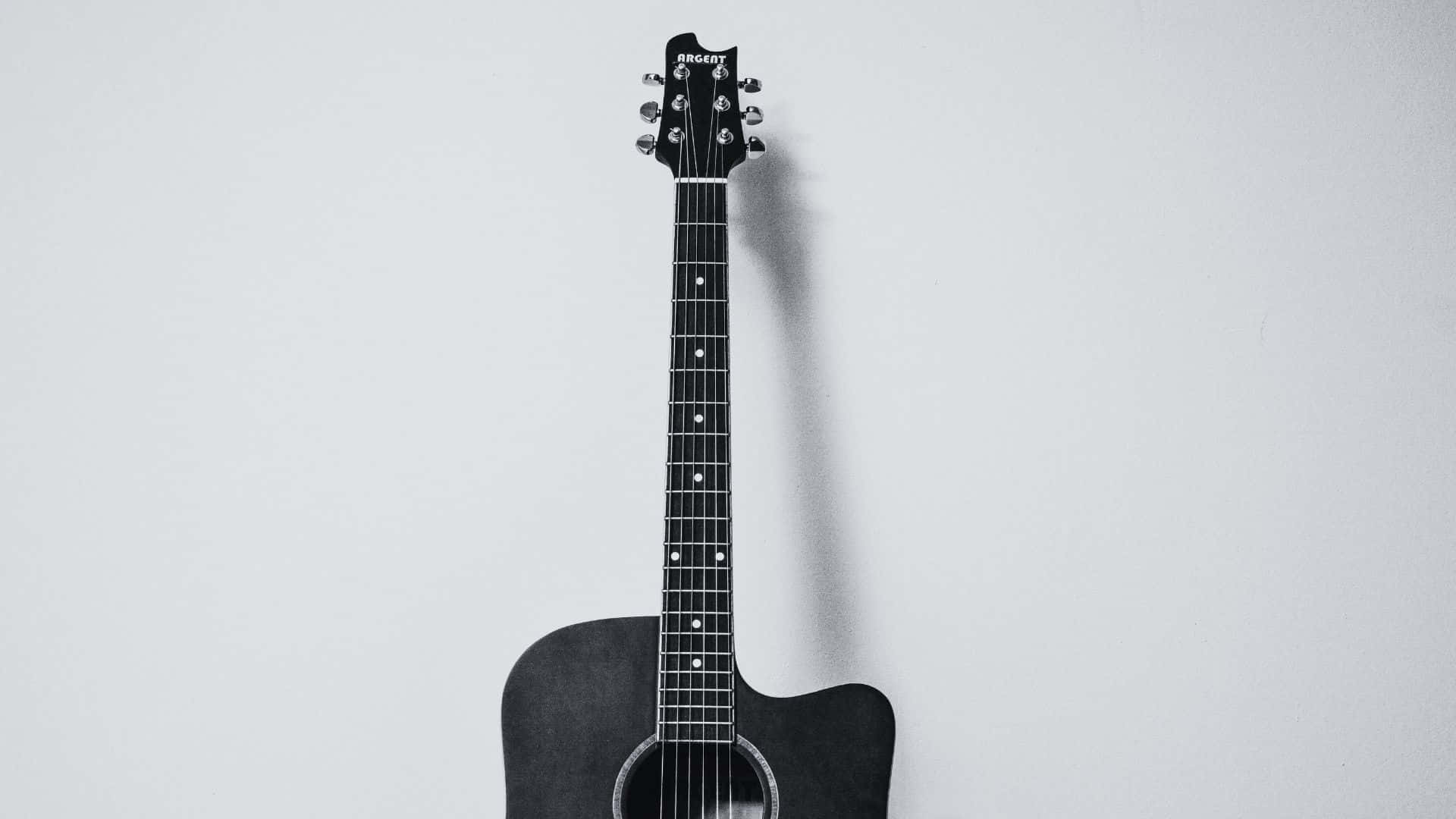 black acoustic guitar, light gray wall, soft shadow, Full HD Desktop Wallpaper