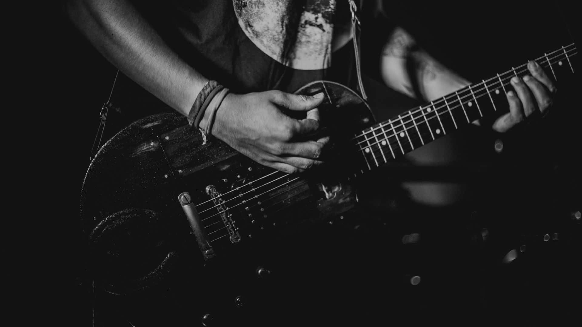 black electric guitar, monochrome, dramatic stage lighting, Full HD Desktop Wallpaper