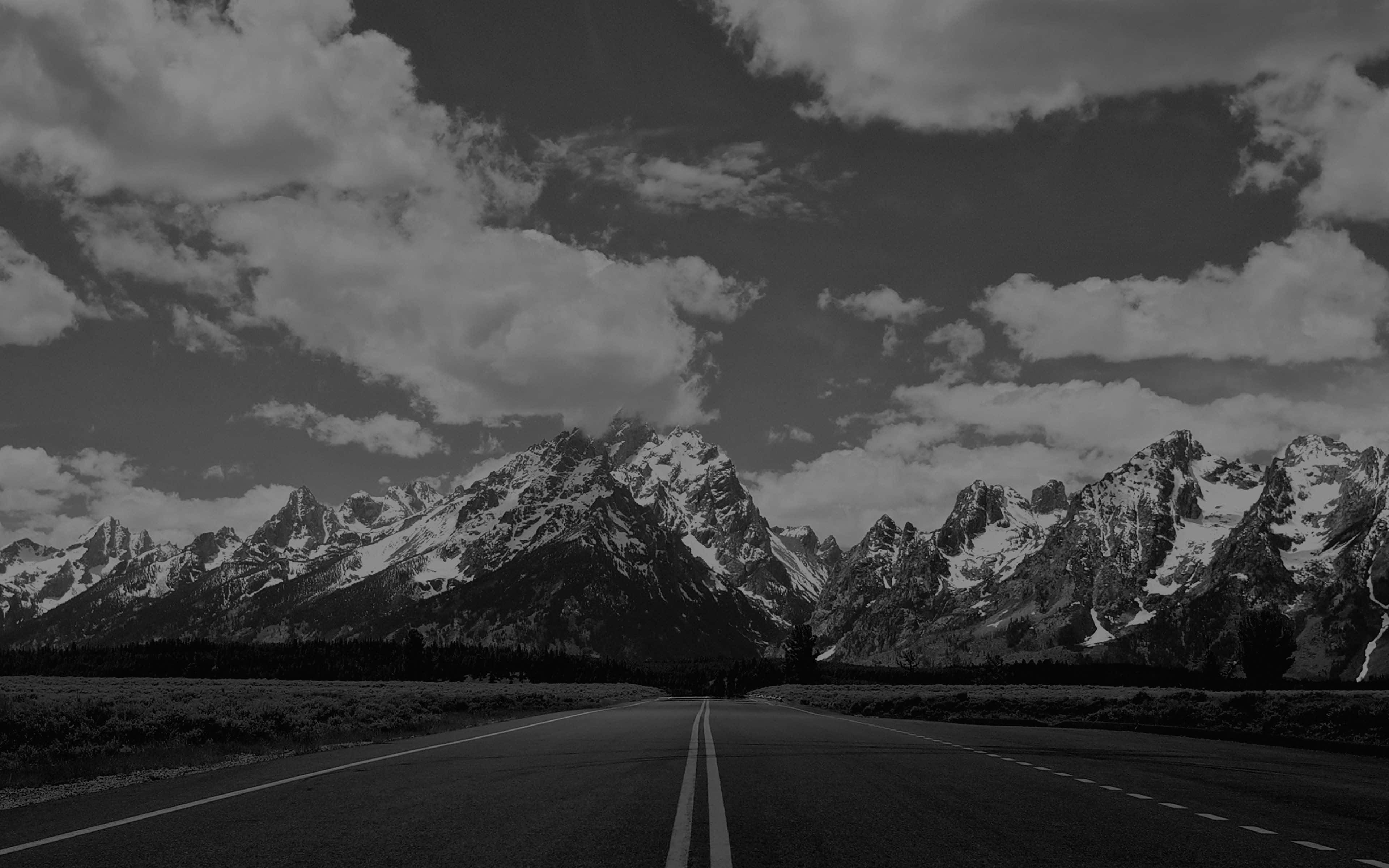 black and white road, snow-capped mountains, dramatic cloudy sky, 4K Desktop Wallpaper