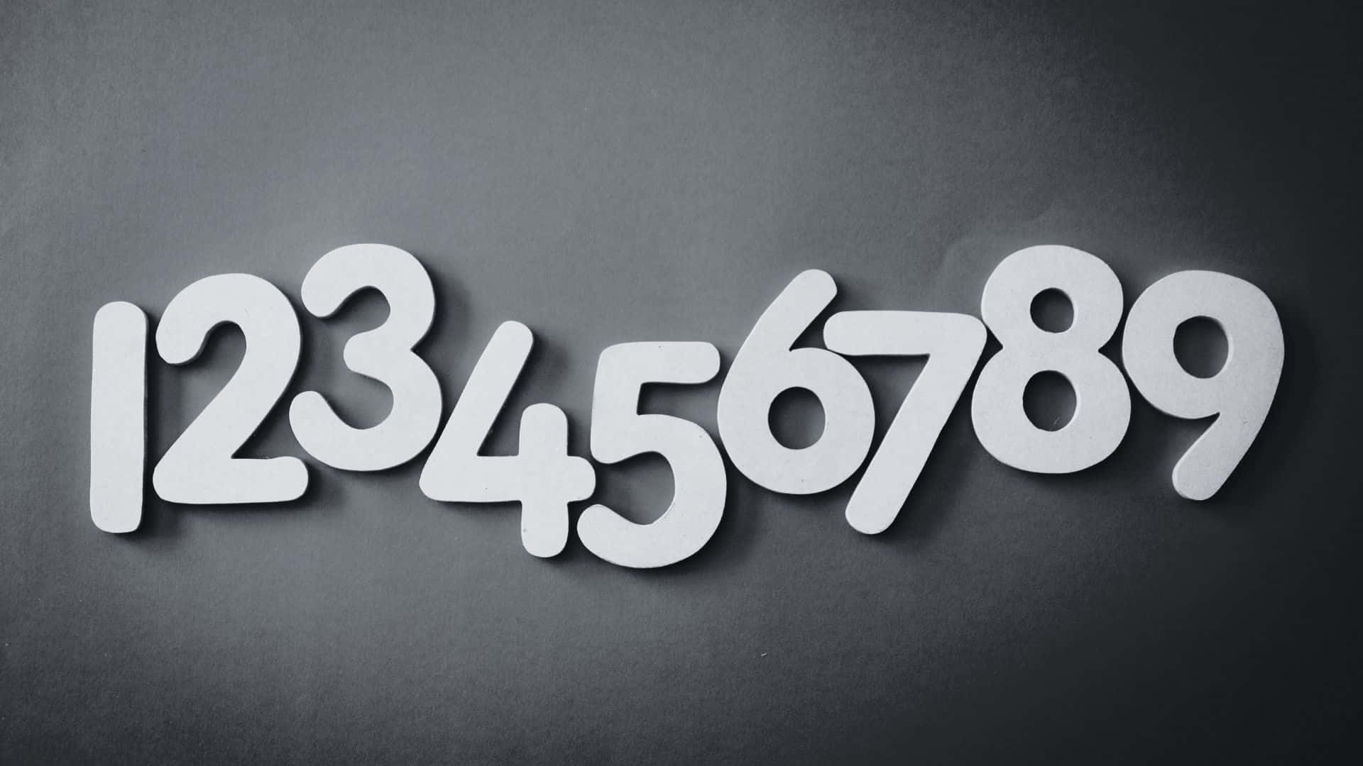 white cutout numbers one through nine, dark gray textured surface, soft shadows, Full HD Desktop Wallpaper