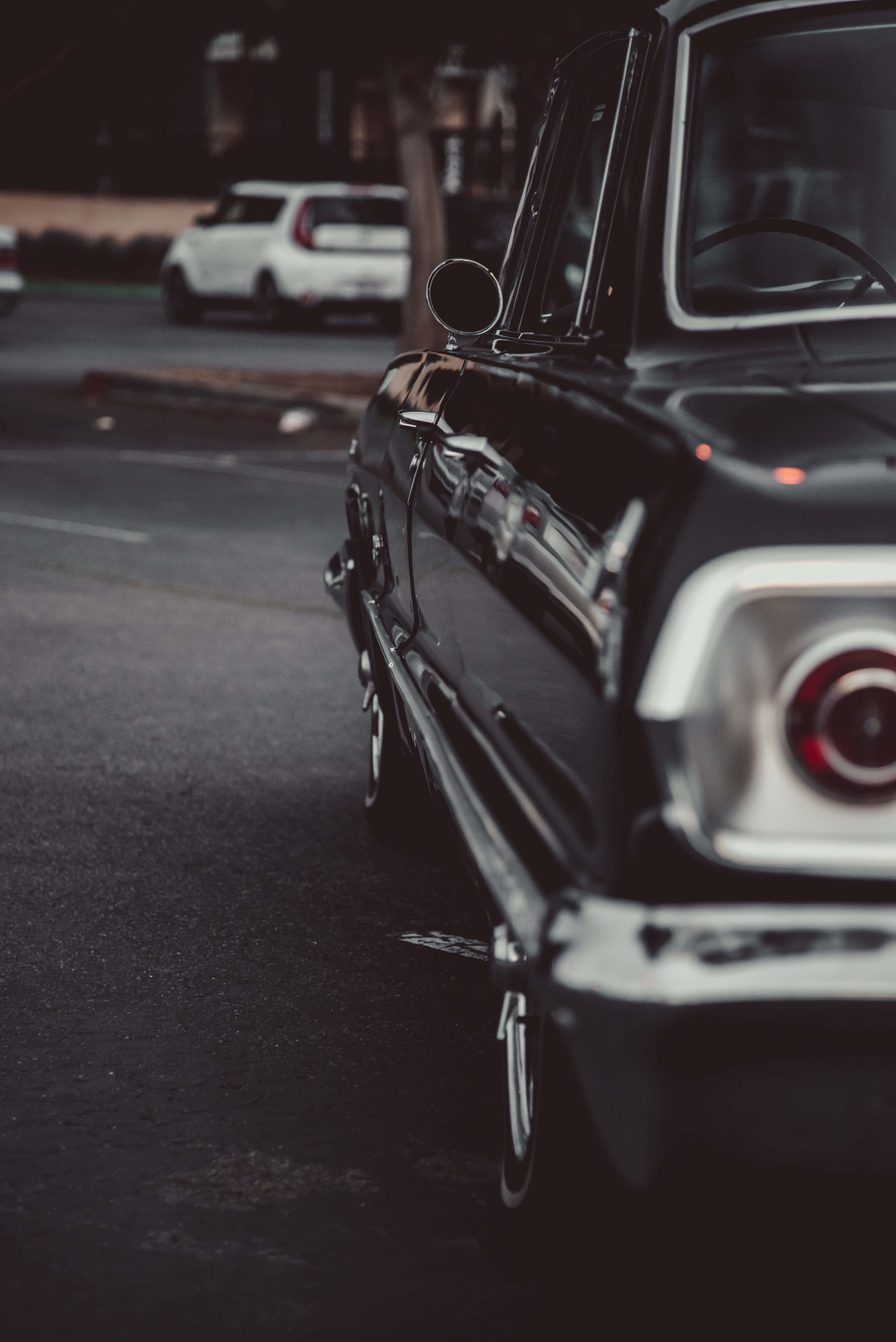 Black and White Vintage Car, sleek black vintage car, dimly lit street, 5K Phone Wallpaper