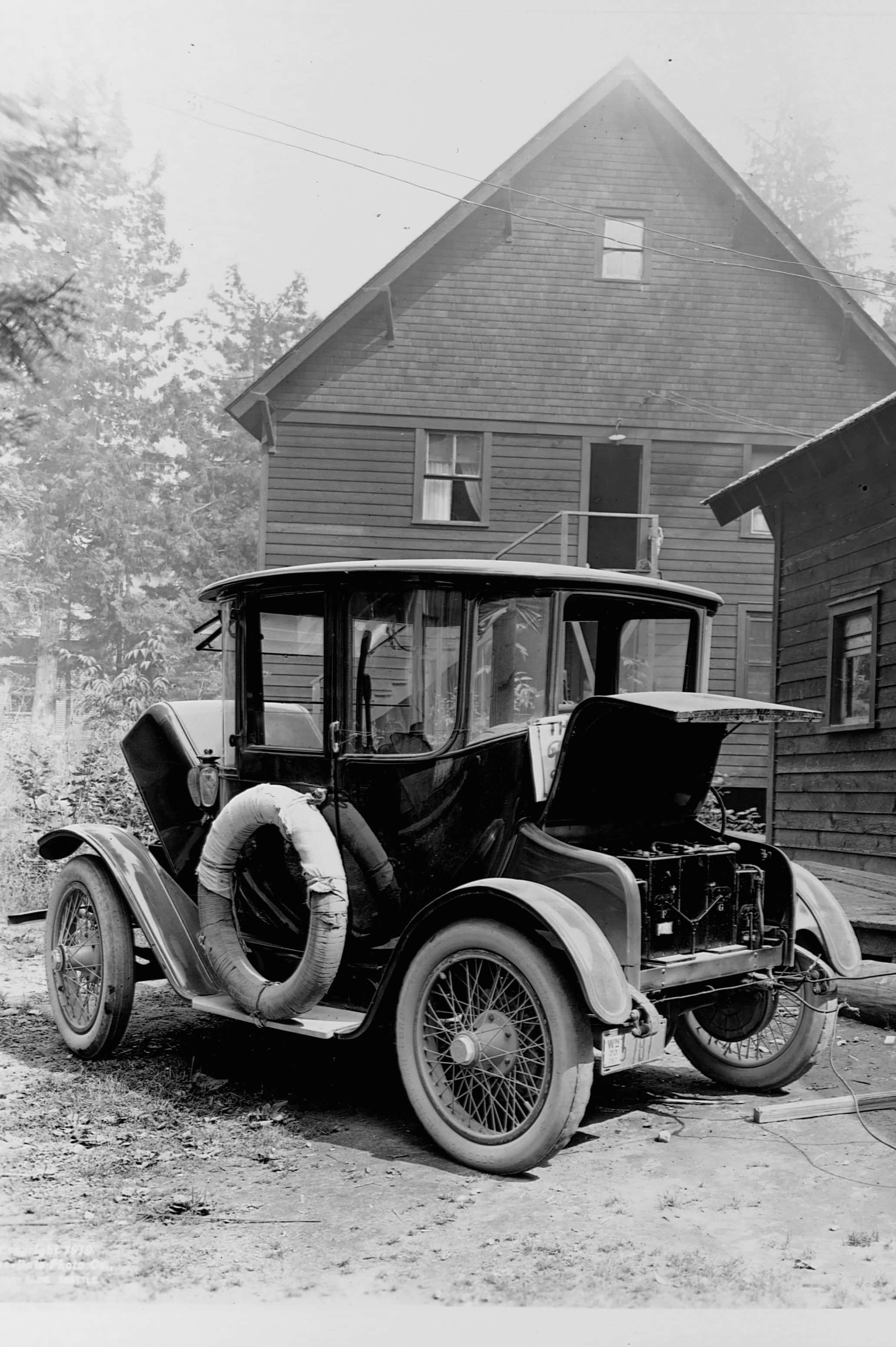 Vintage black automobile, open hood, spare tire, 2K Phone Wallpaper