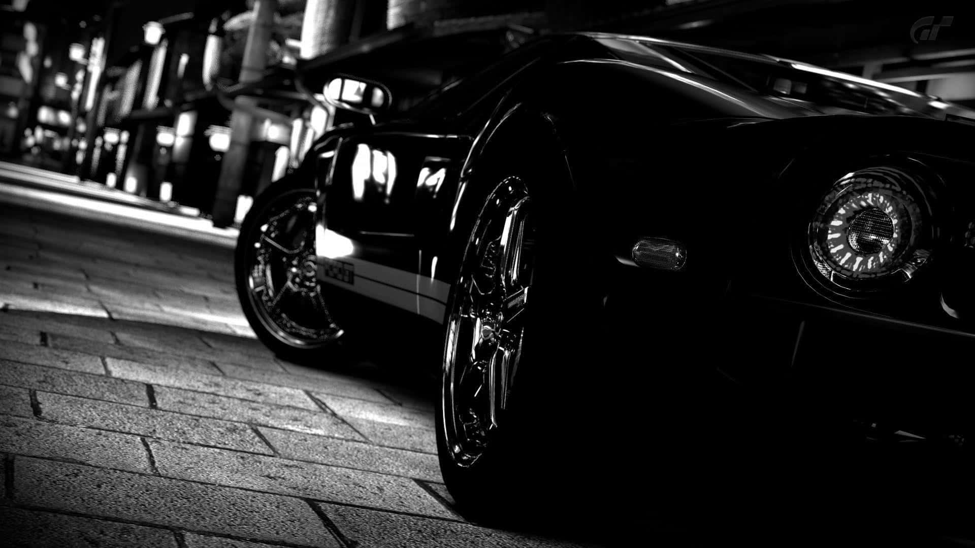 black sports car, dramatic night lighting, wet cobblestone street, Full HD Desktop Wallpaper