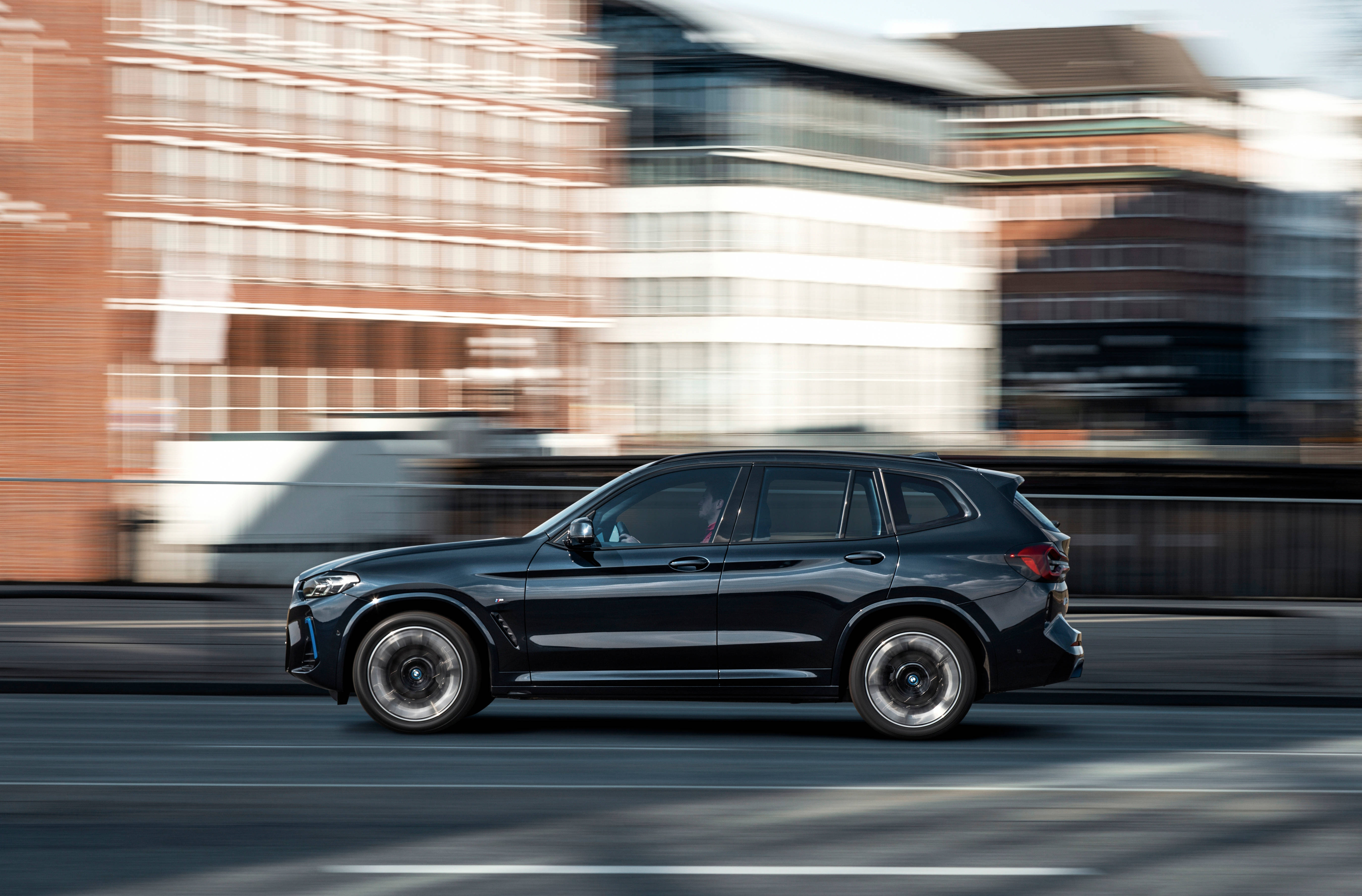 Black Bmw, sleek black SUV, blurred urban buildings, 5K Desktop Wallpaper