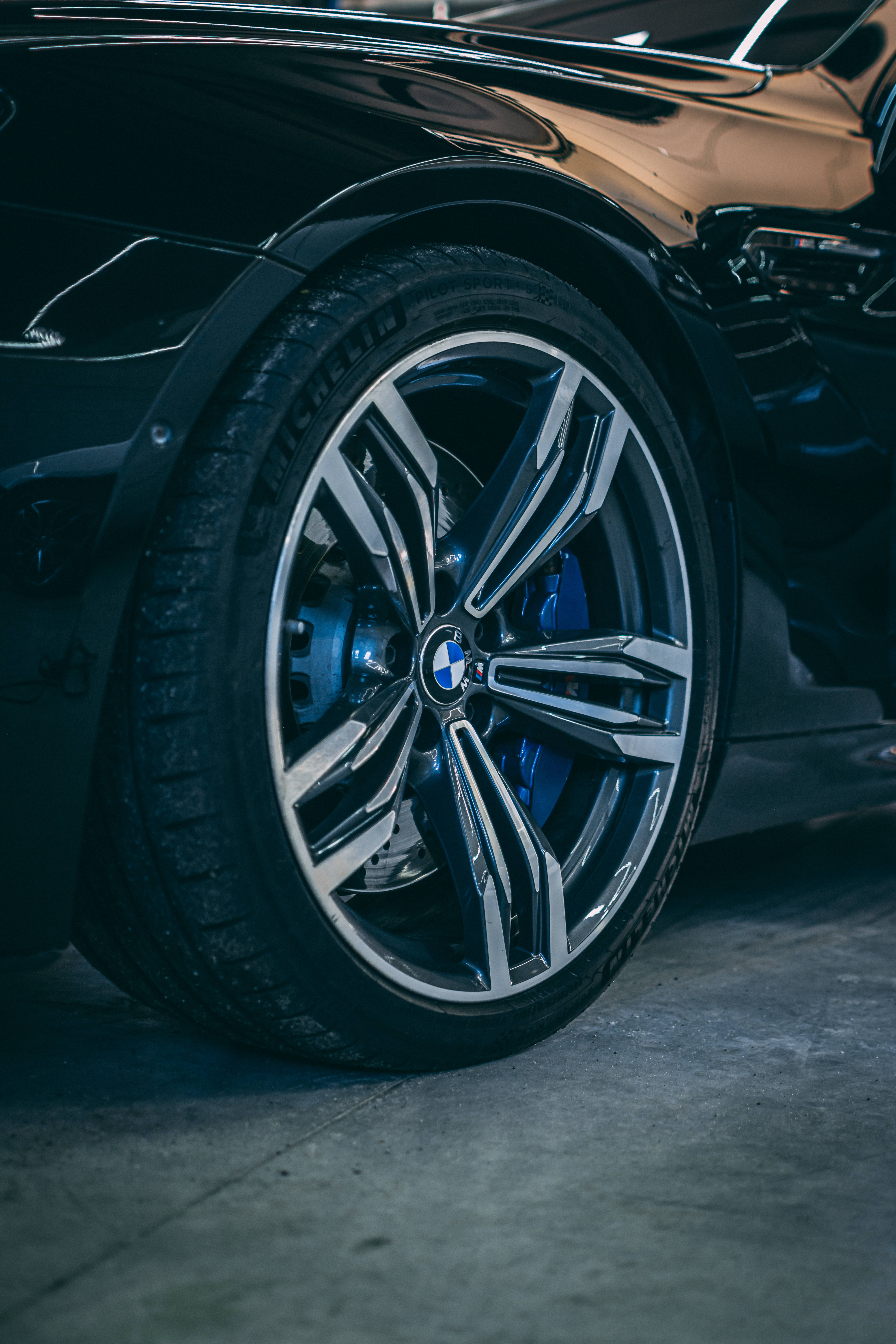 Black BMW, blue brake calipers, shiny chrome rims, 5K Phone Wallpaper