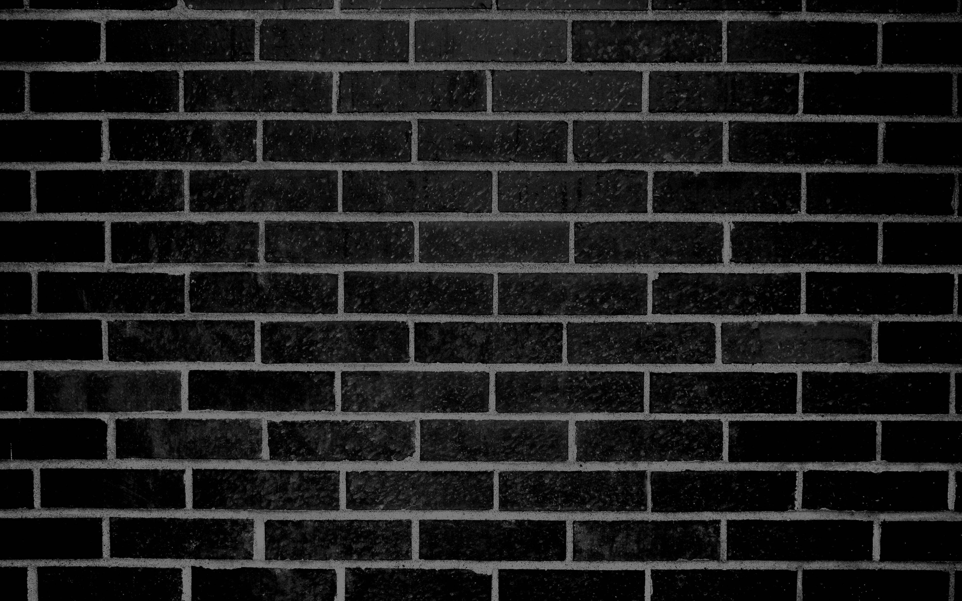 black brick wall tiles, textured mortar lines, moody urban backdrop, 4K Desktop Wallpaper
