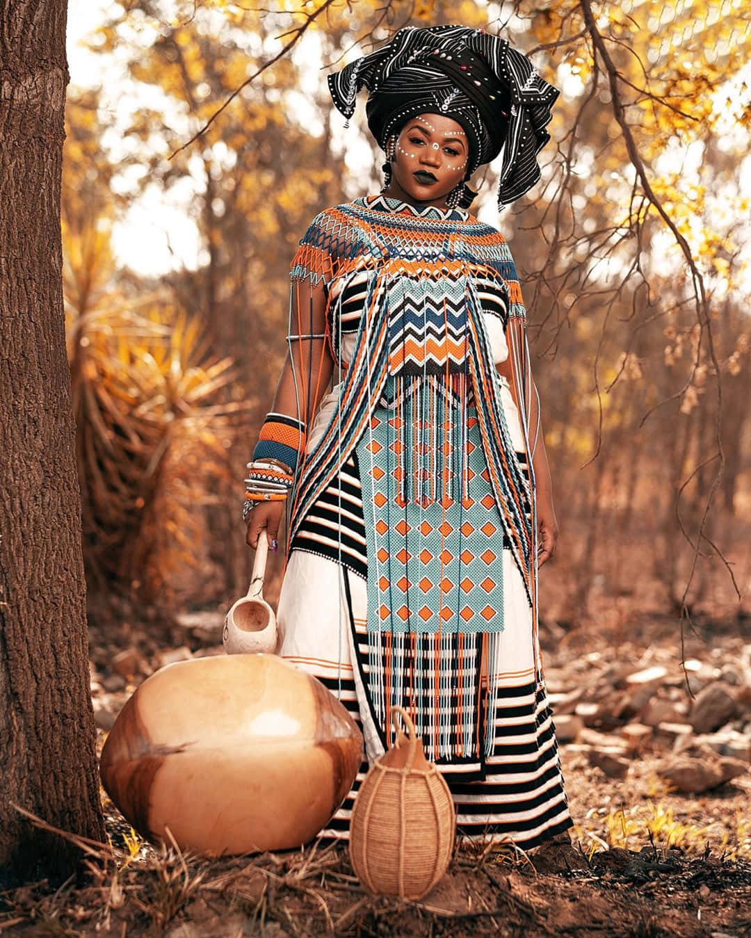 vibrant geometric-patterned traditional attire, sunlit forest, gourd, HD Phone Wallpaper