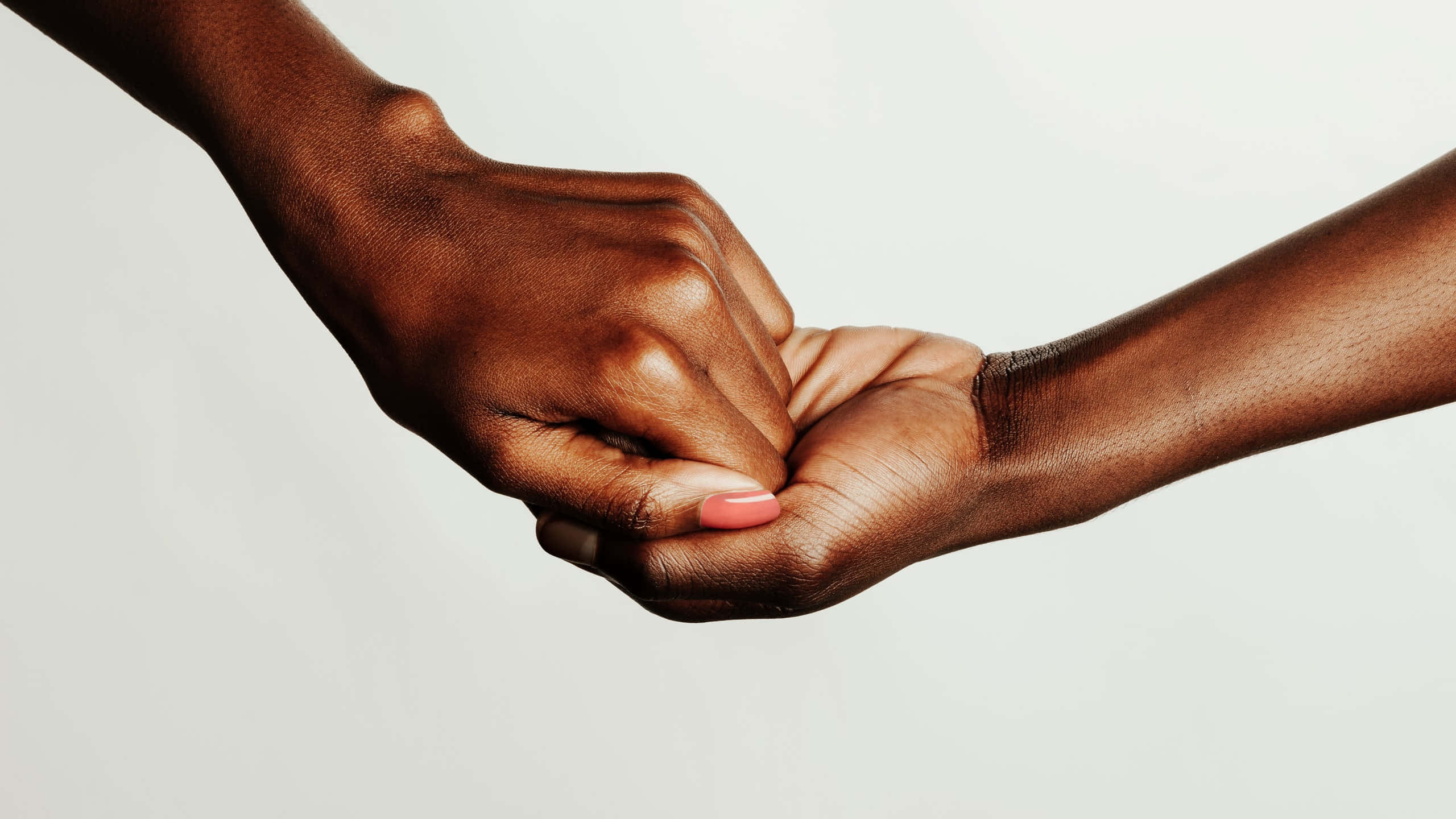 dark-skinned hands, soft white background, unity, 2K Desktop Wallpaper