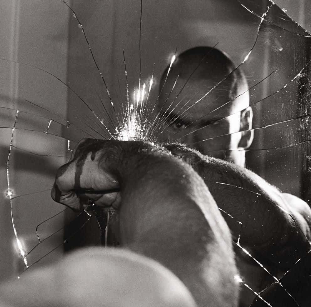 Black Flag, punches through a cracked mirror, dramatic black and white photo, SD Desktop Wallpaper