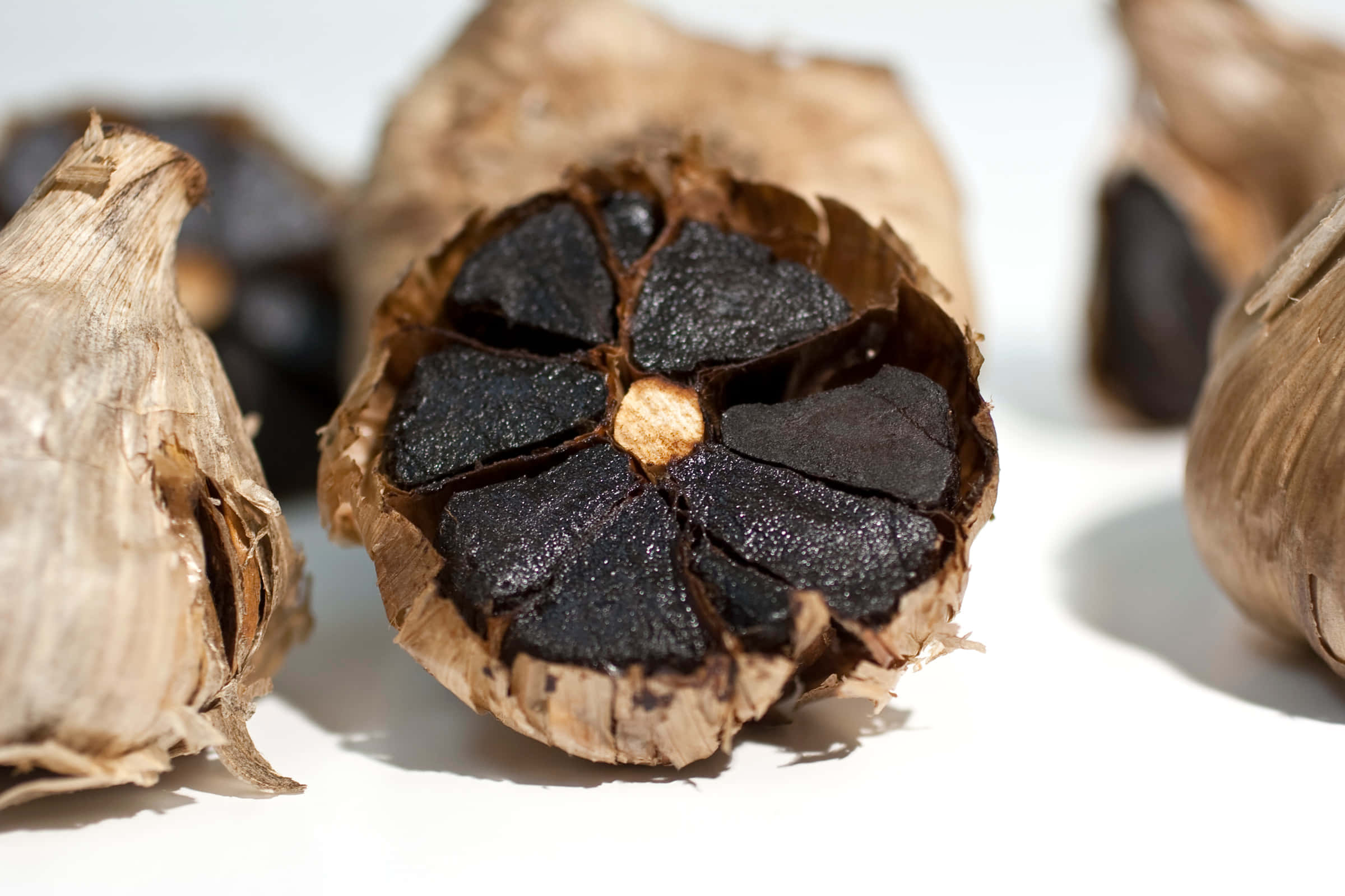 black garlic, split black garlic bulb, glossy dark cloves, Full HD Desktop Wallpaper