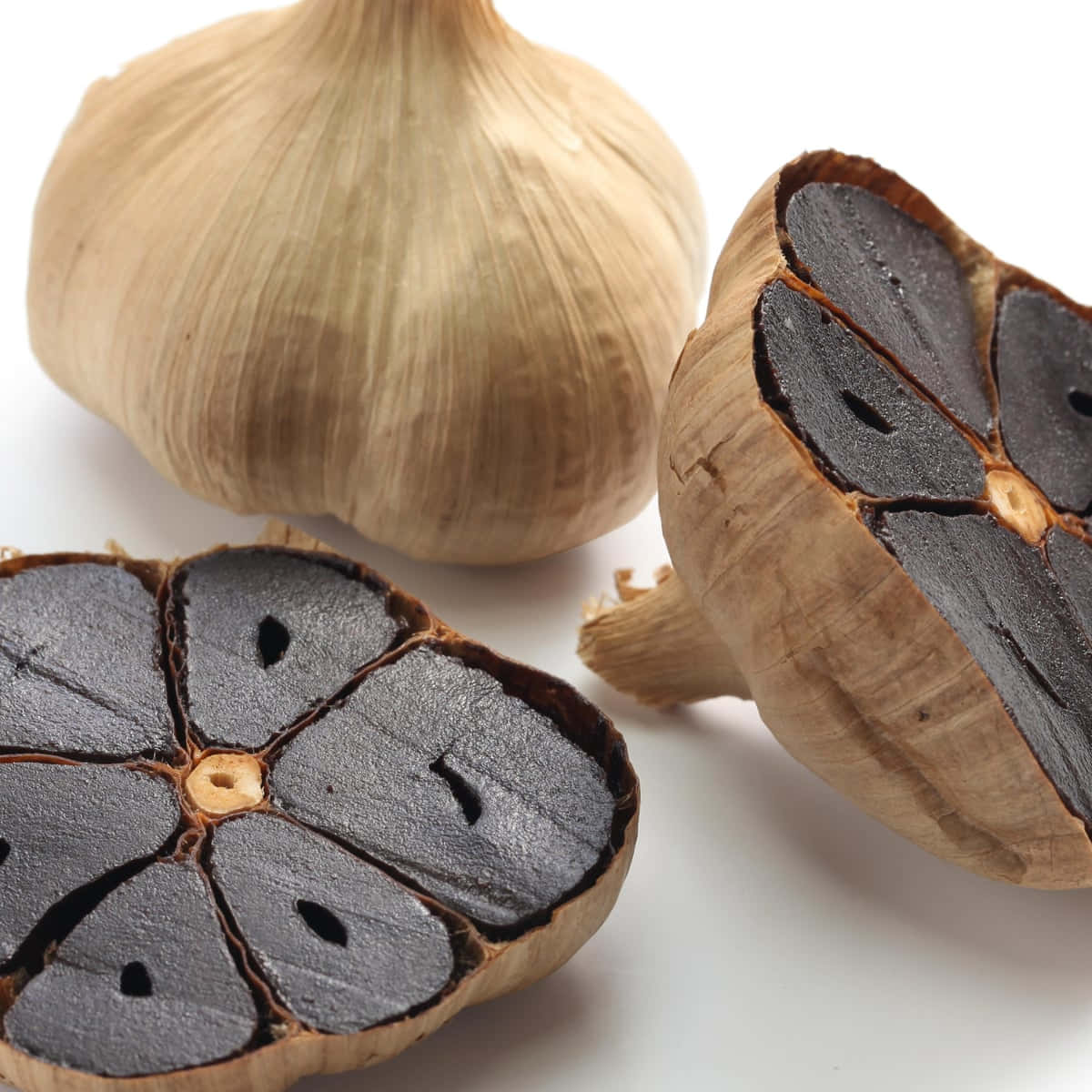 black garlic, dark glossy interiors, pale papery skins, SD Desktop Wallpaper
