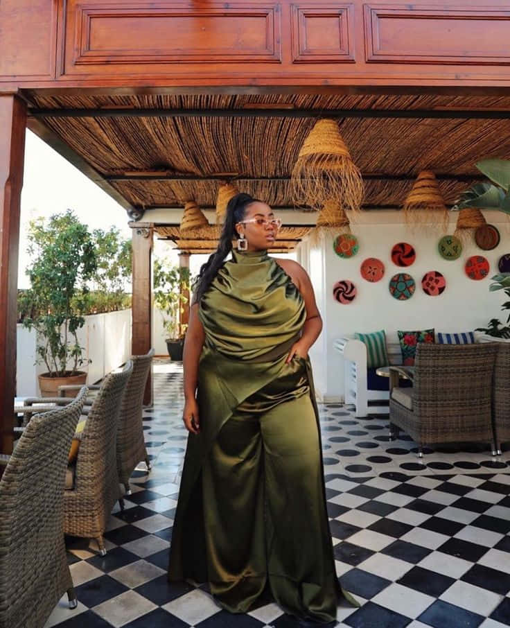 olive green satin dress, black and white checkered patio, thatched roof, SD Phone Wallpaper