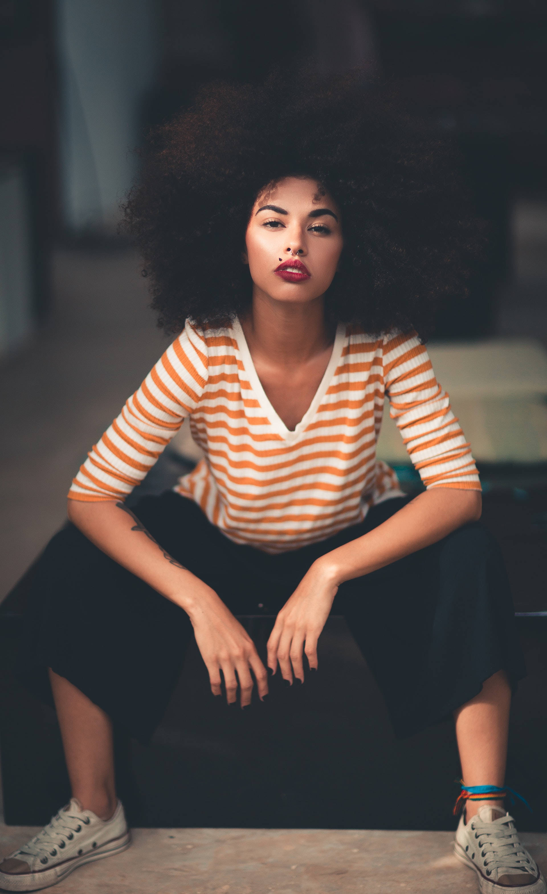 black woman, curly weave afro hair, orange and white striped shirt, 2K Phone Wallpaper