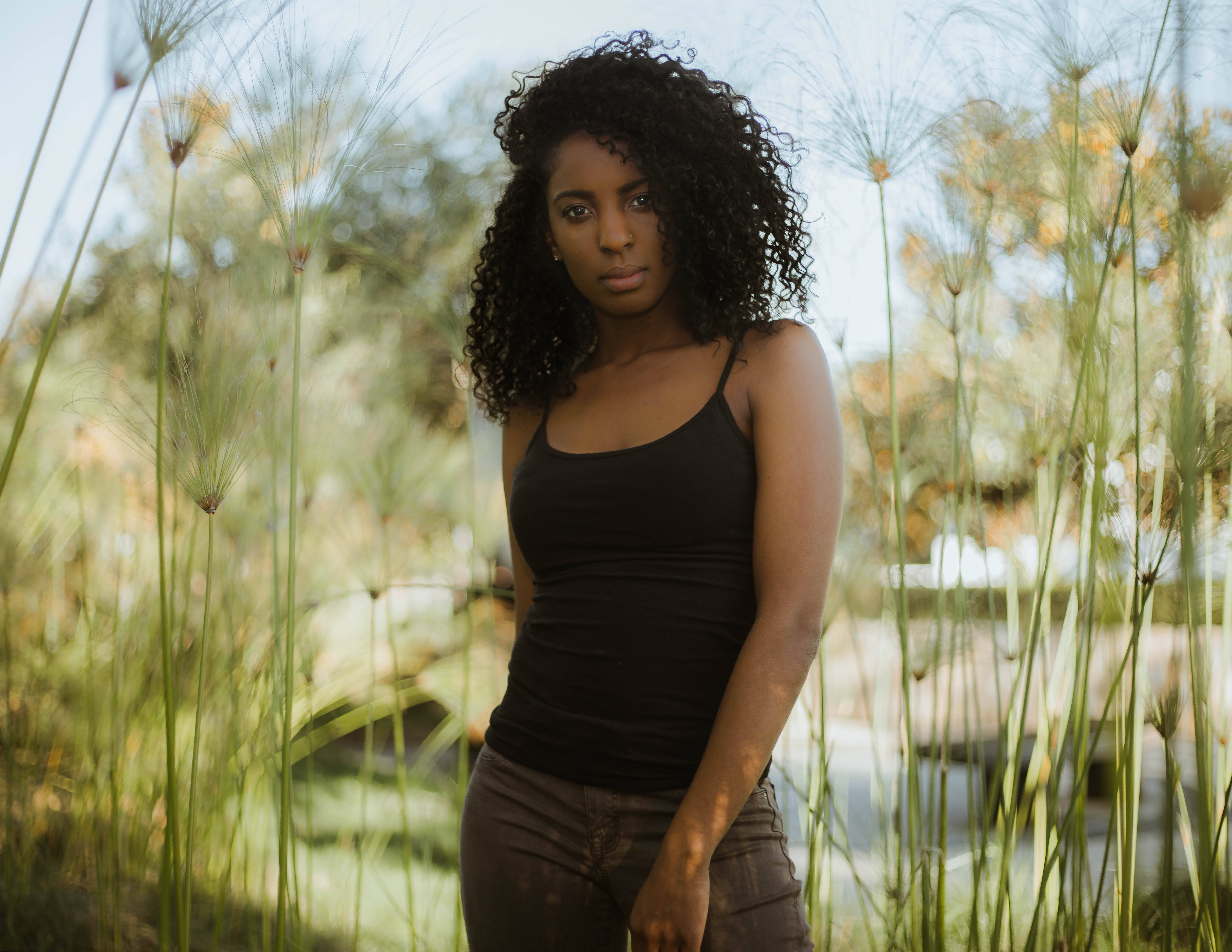 Beautiful Black Girl, curly hair, tall grasses, 5K Desktop Wallpaper