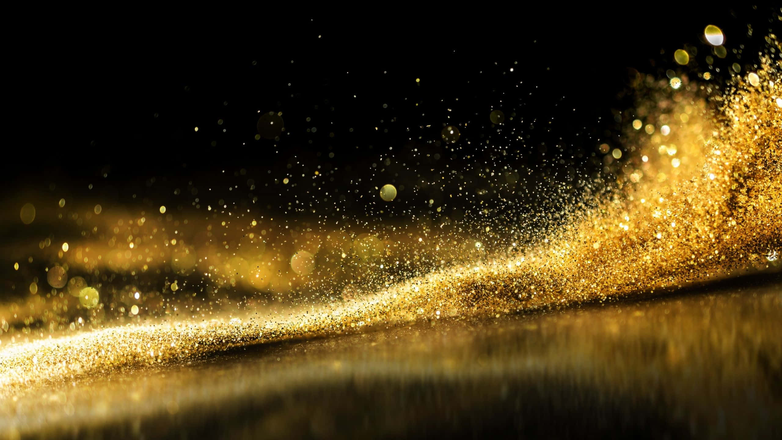 black and gold glitter, glowing golden particles, dark surface, 2K Desktop Wallpaper