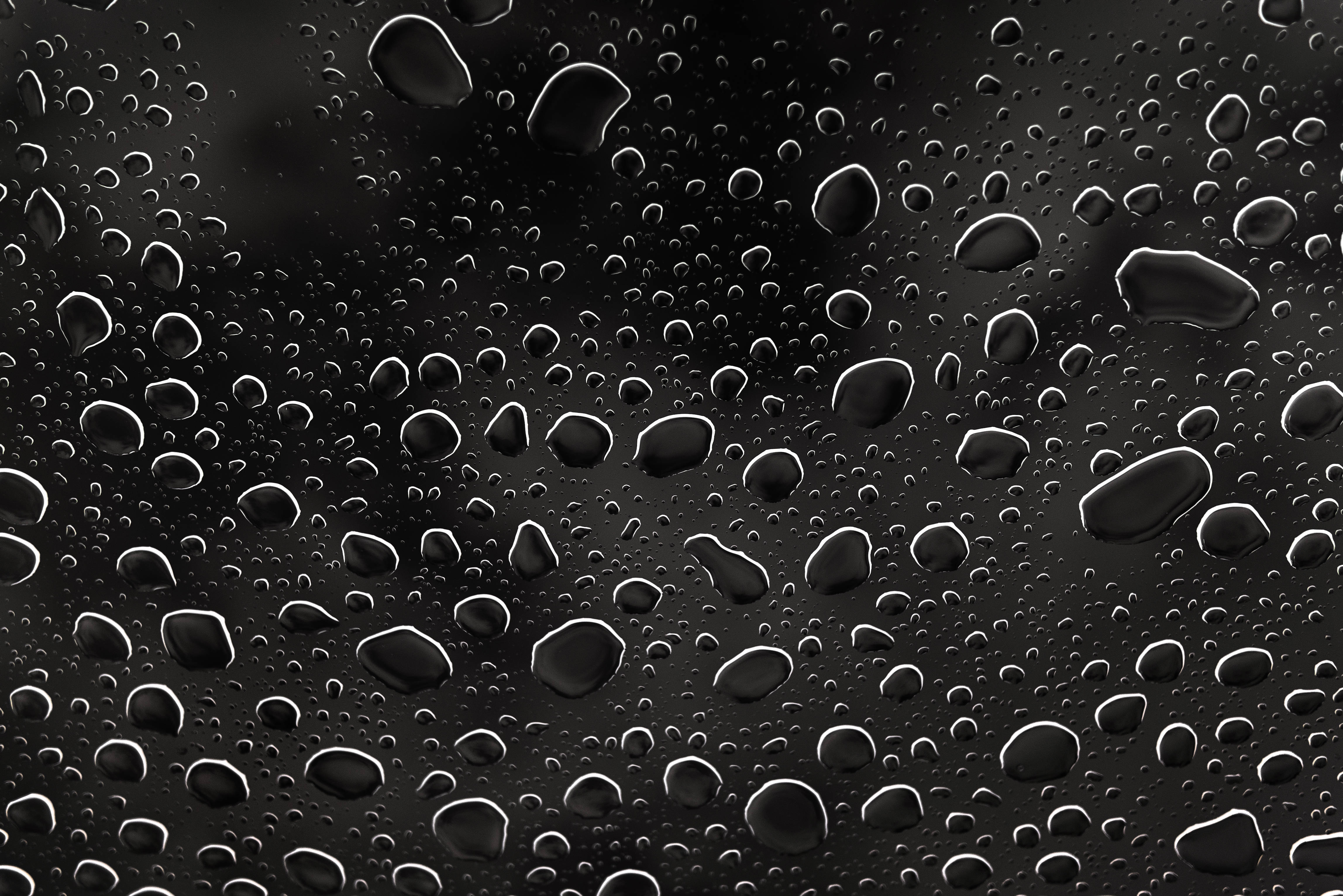 water drops, dark surface, moody abstract texture, 4K Desktop Wallpaper