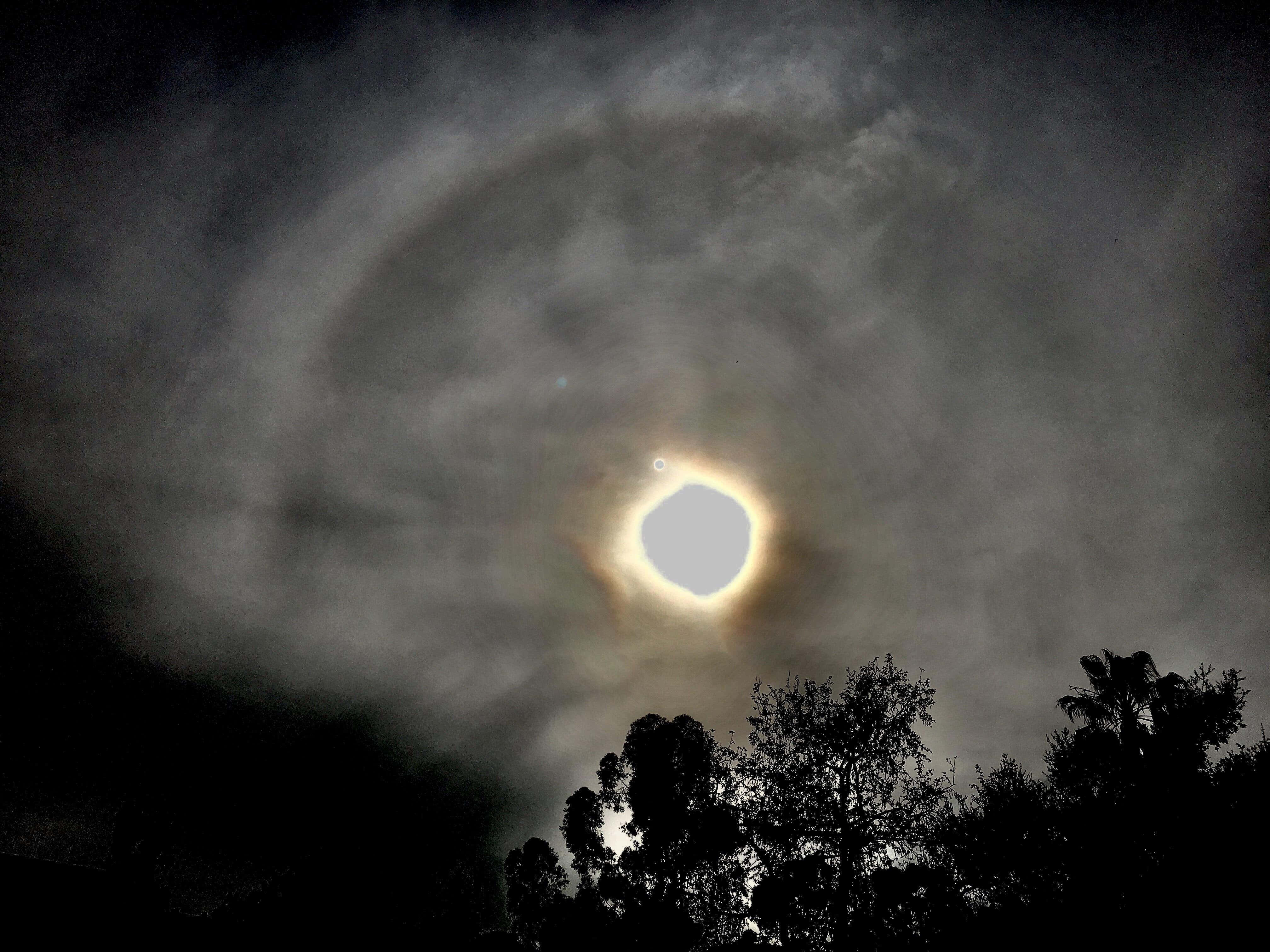 Black Hole Sun, solar eclipse, swirling clouds, 4K Desktop Wallpaper