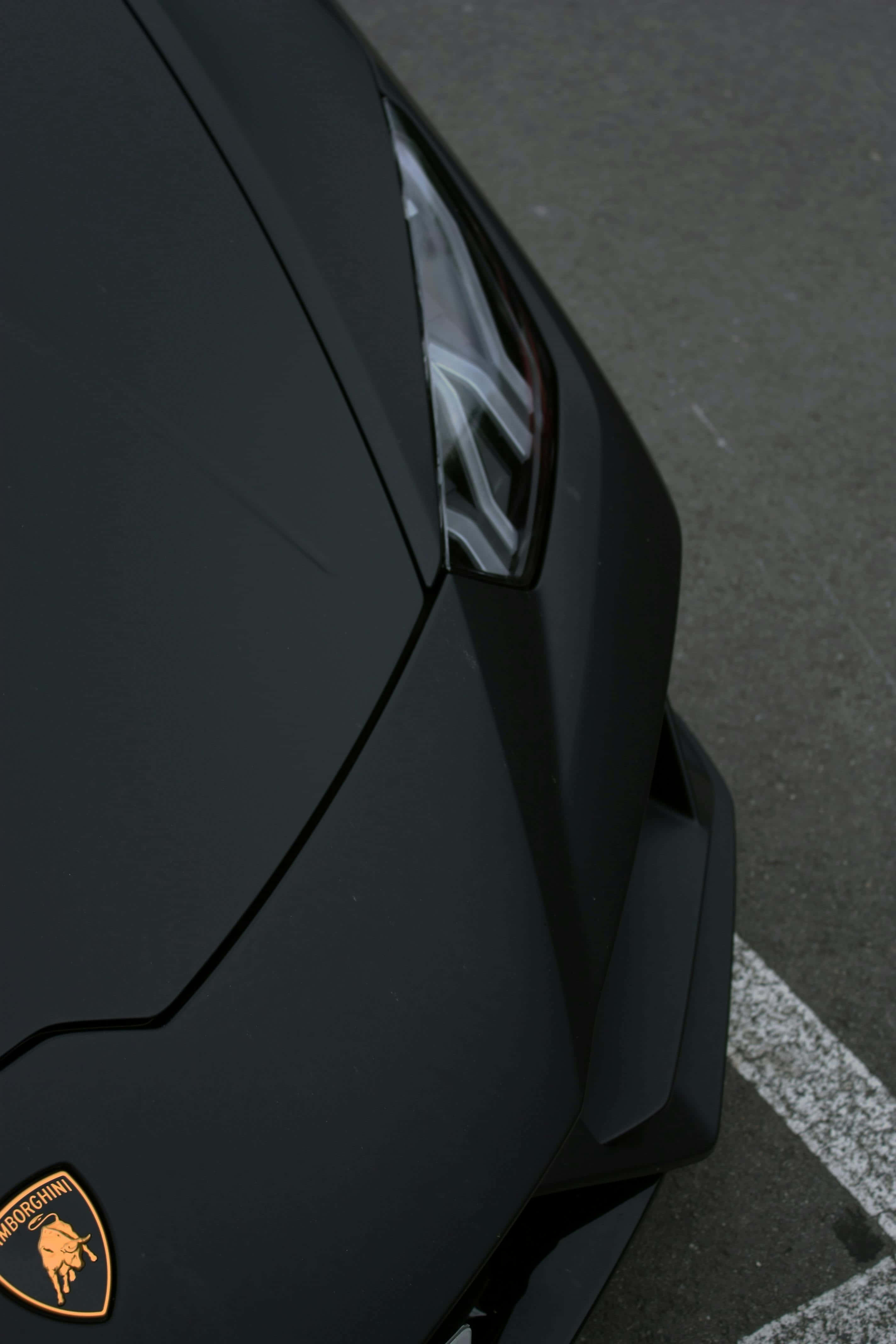 matte black Lamborghini, gold bull logo, asphalt, 4K Phone Wallpaper