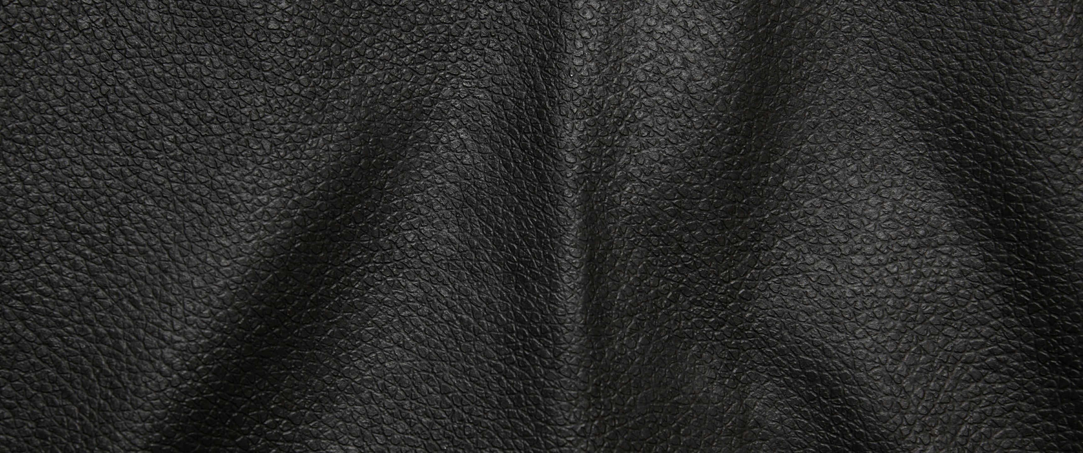 black pebbled leather, natural folds, grain texture, 2K Desktop Wallpaper