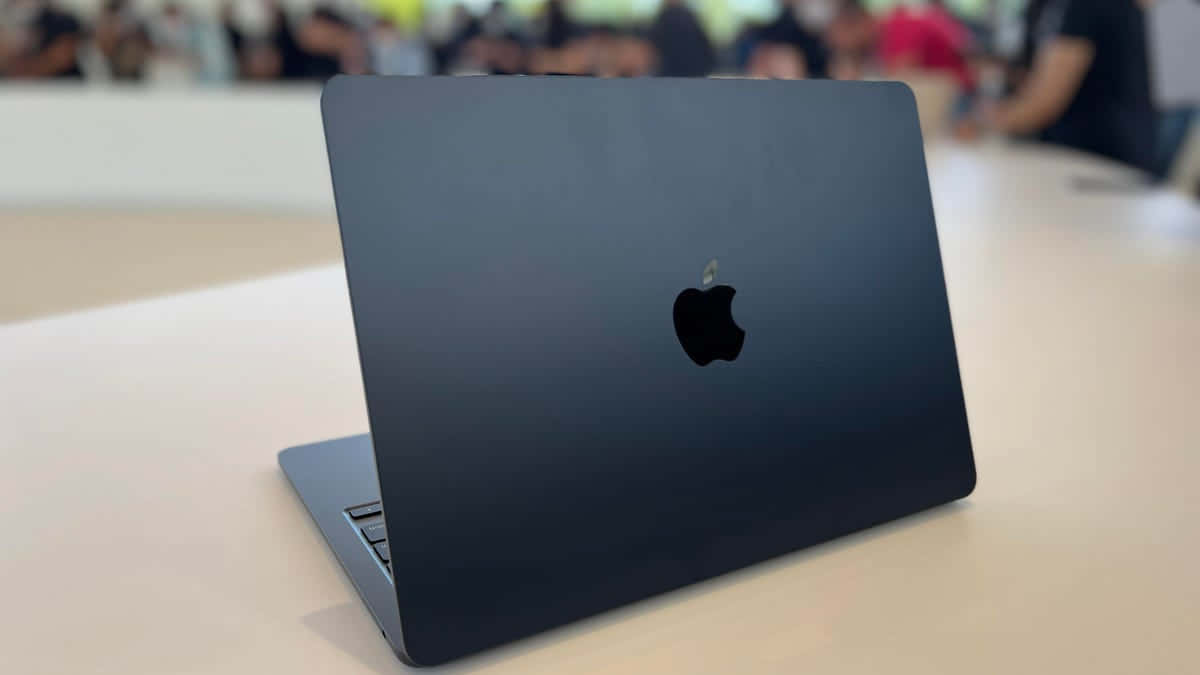 Black Macbook, matte black MacBook, light wooden table, SD Desktop Wallpaper