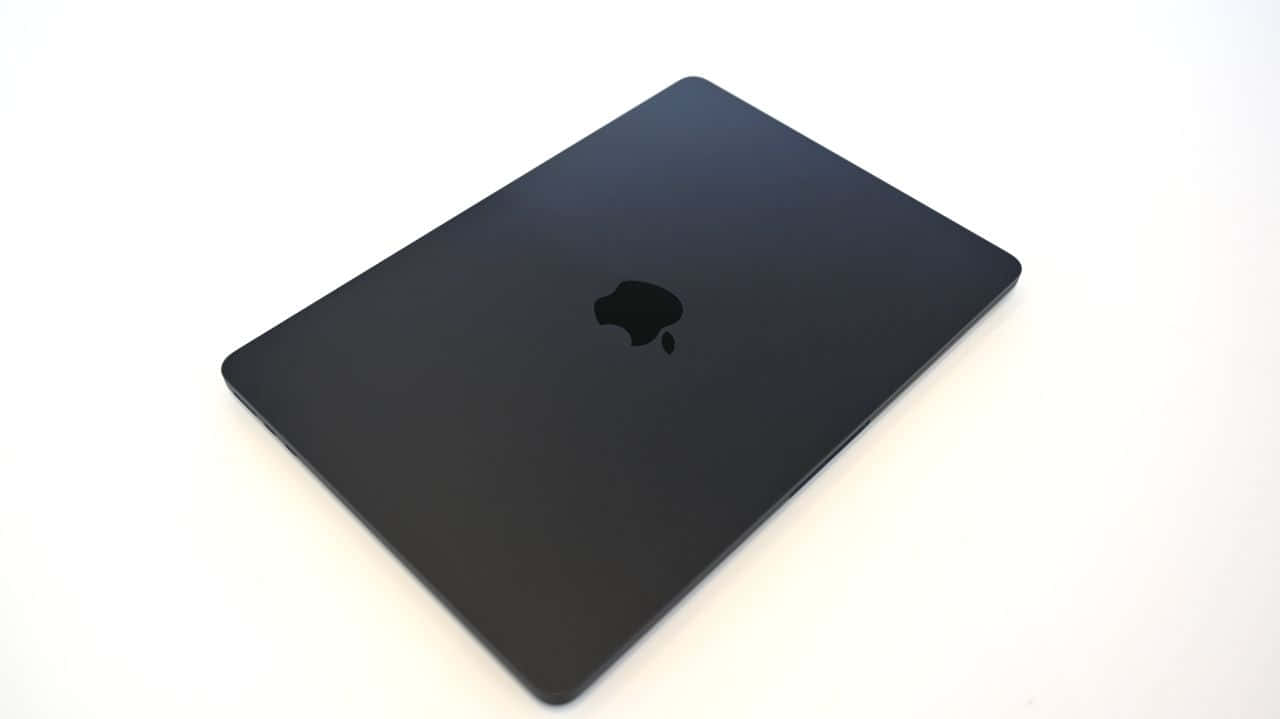 black MacBook, 1280 x 719, pure white surface, HD Desktop Wallpaper