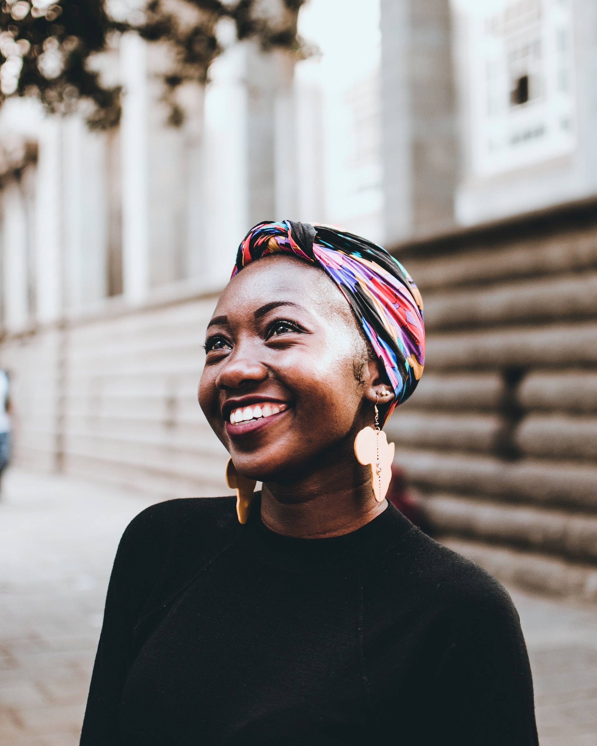 Black Woman, vibrant headwrap, sunlit urban street, Full HD Phone Wallpaper