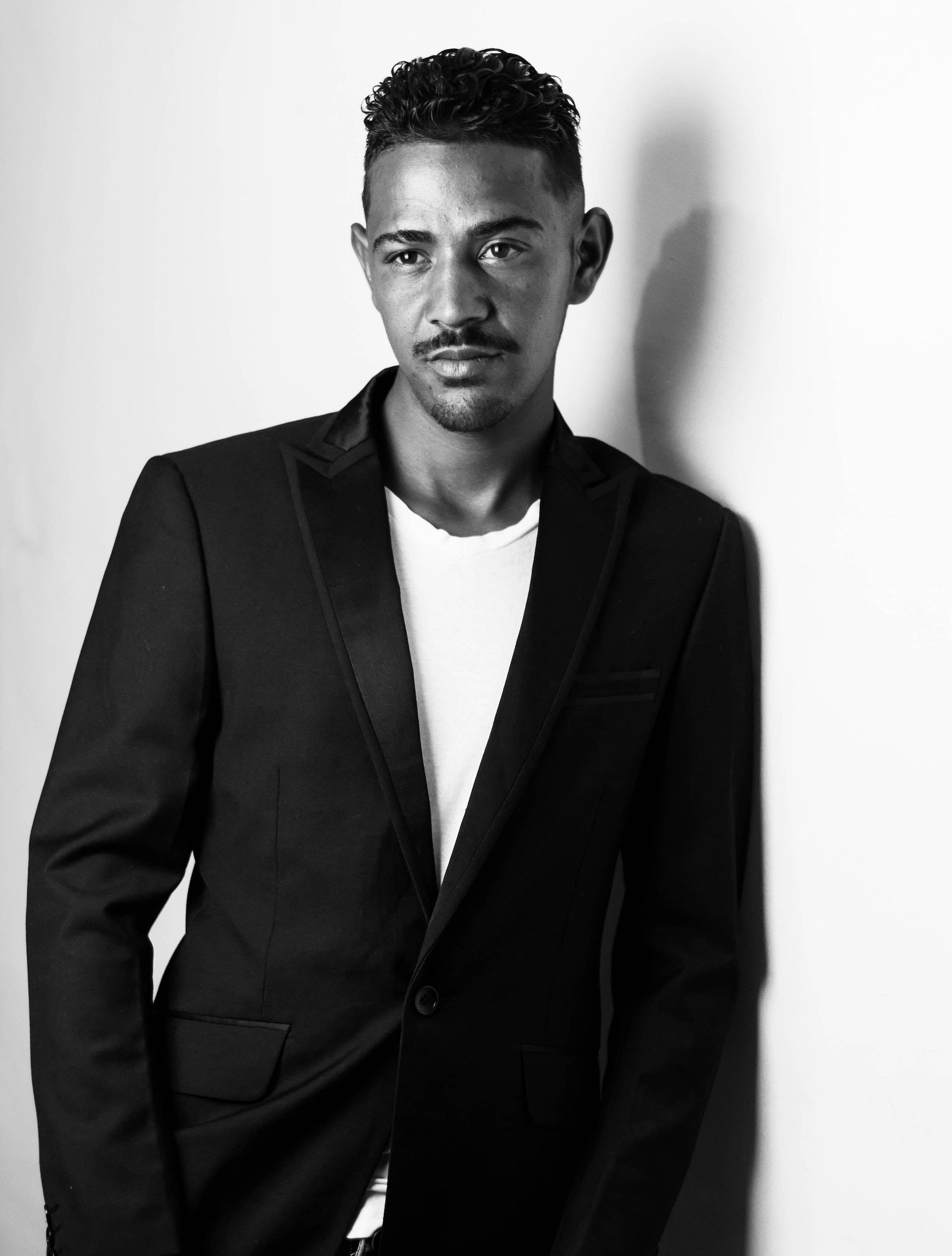 black blazer, plain wall, stark black and white portrait, Full HD Phone Wallpaper