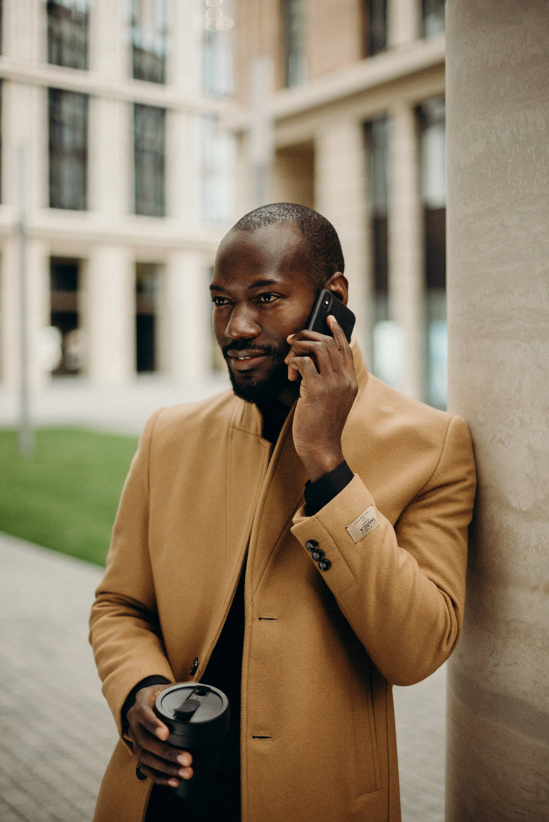 Black Man, tan coat, pillar, 2K Phone Wallpaper