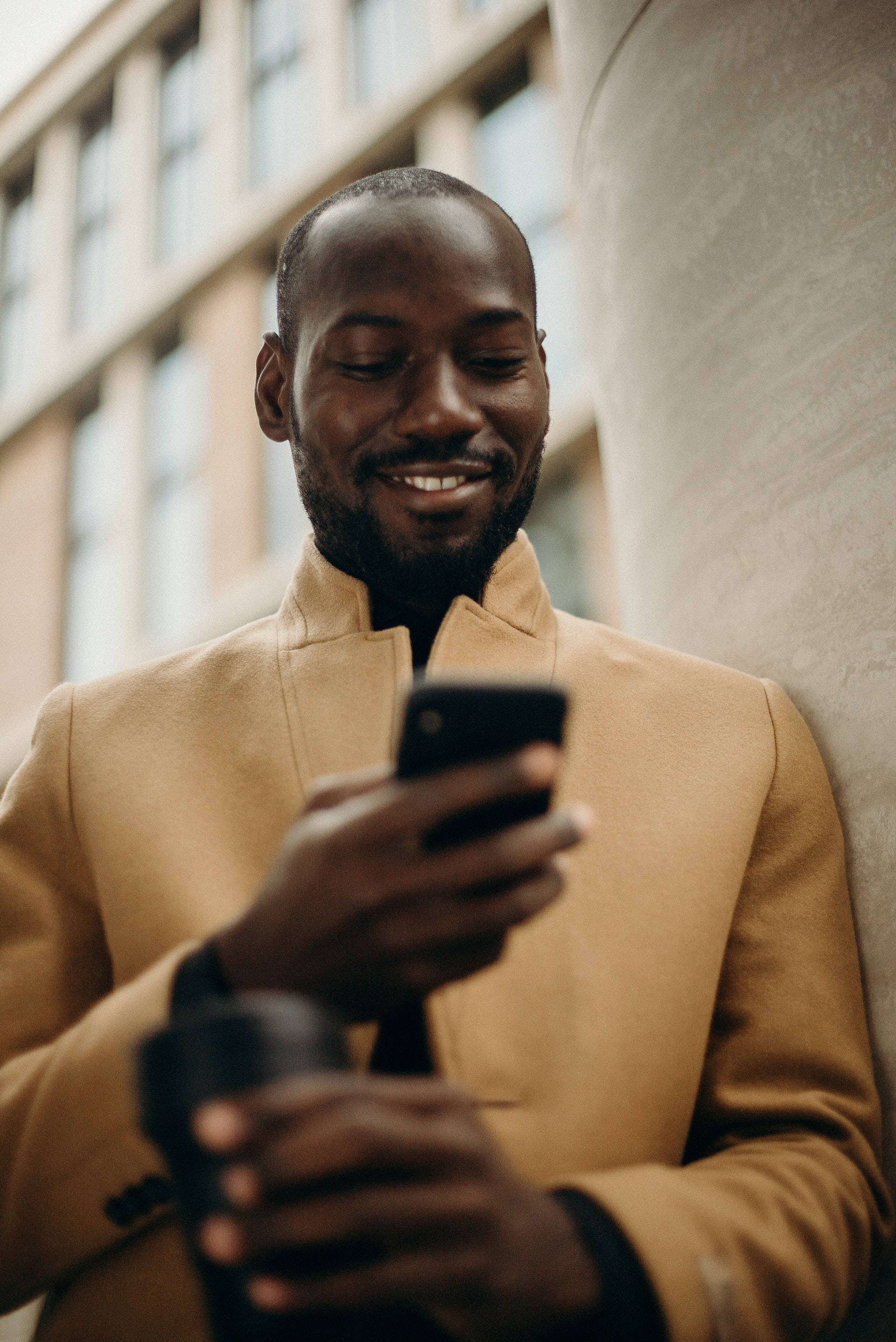 Black Man, tan coat, wall, 2K Phone Wallpaper